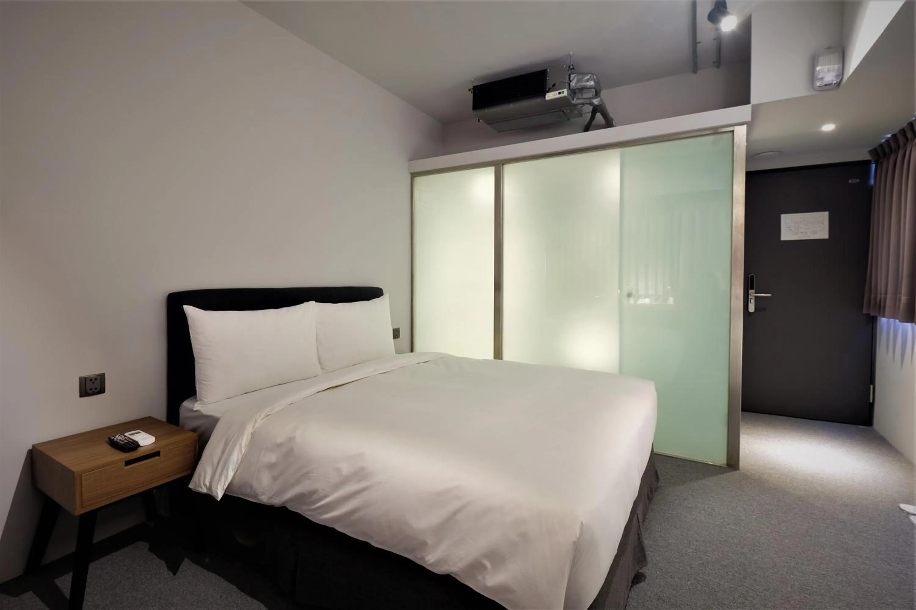 Bed in Doudian DDiNN Hotel