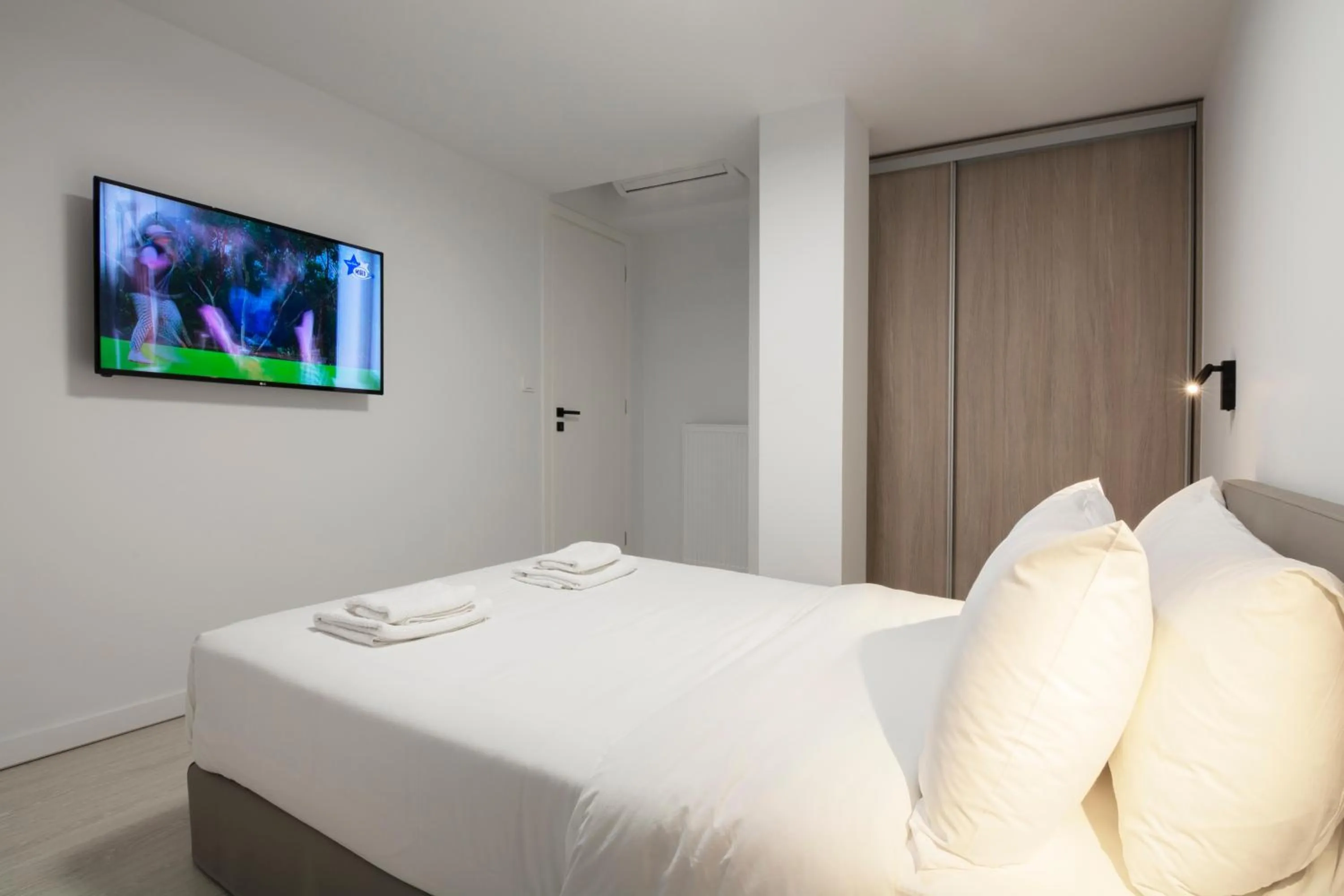 Bed in Heritage Boutique Apartments