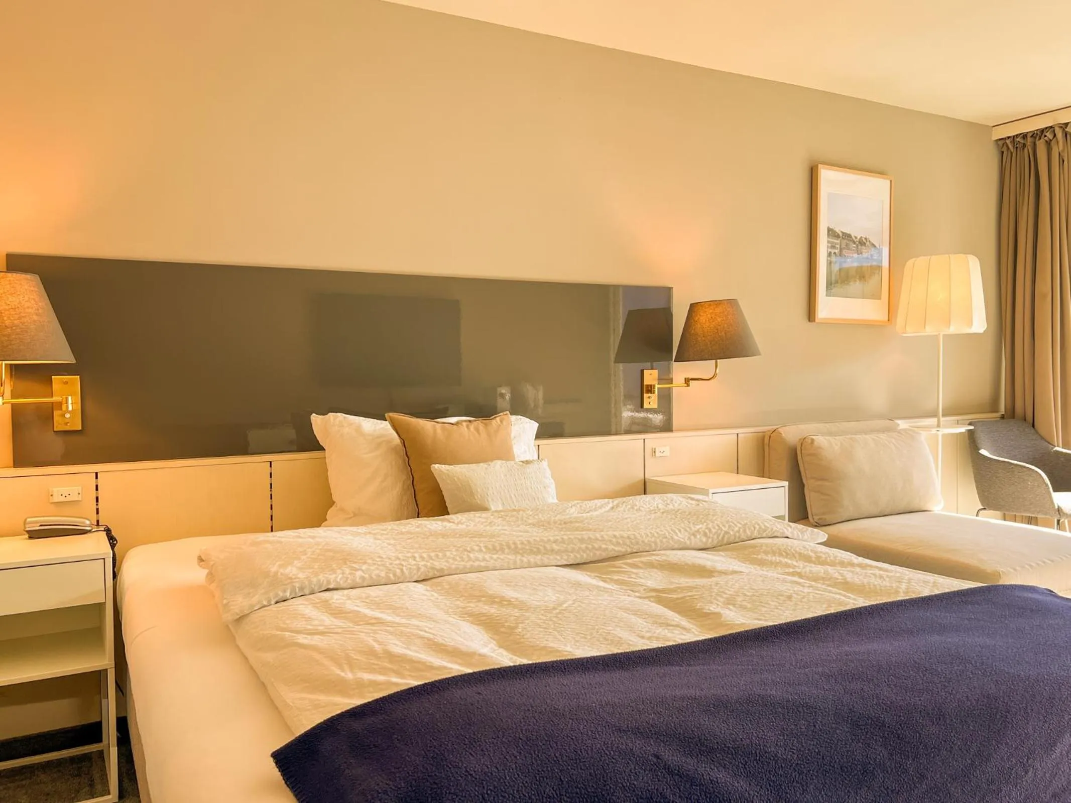 Bed in Seehotel Riviera at Lake Lucerne