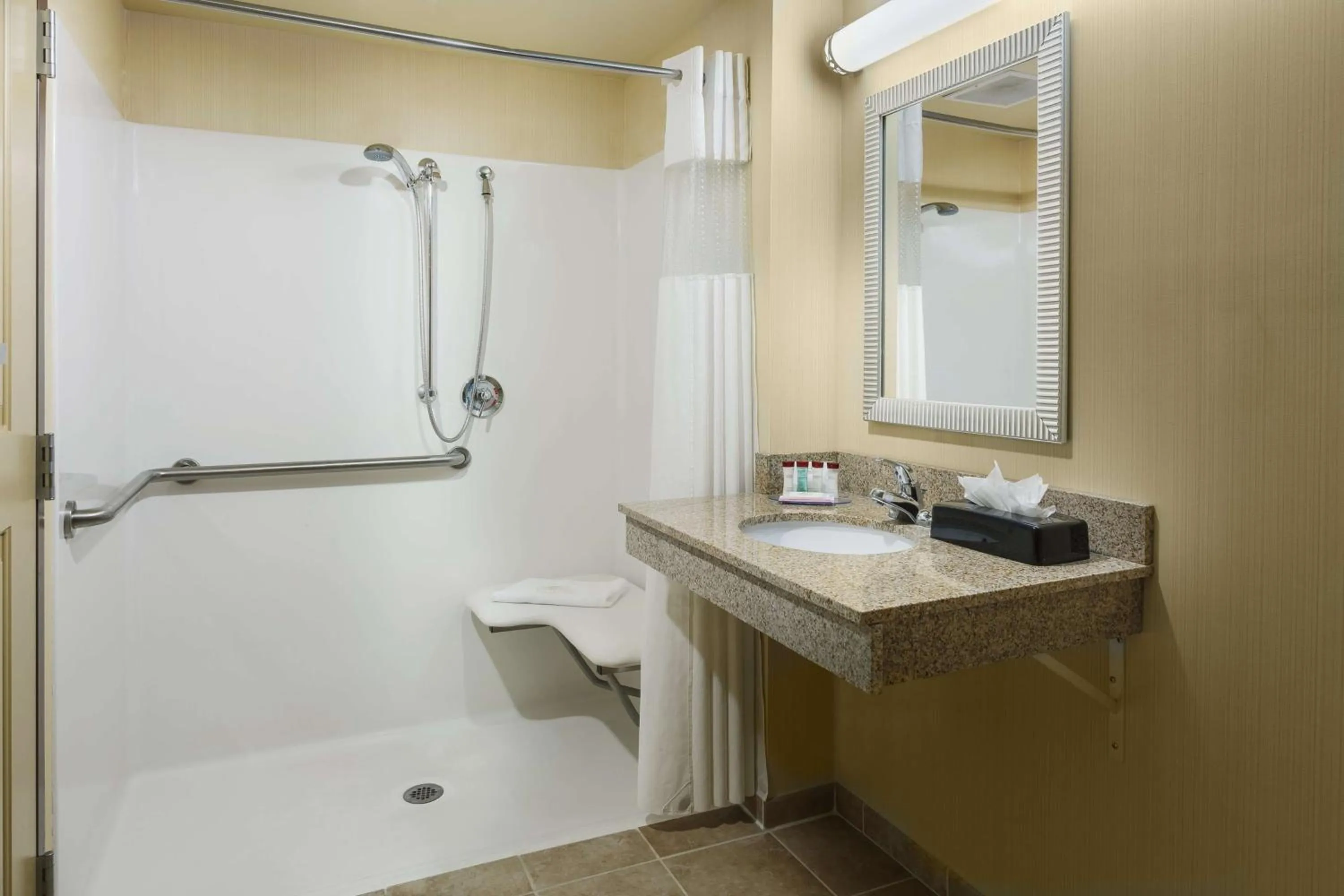 Bathroom in Roosevelt Grand Dakota SureStay Collection by Best Western