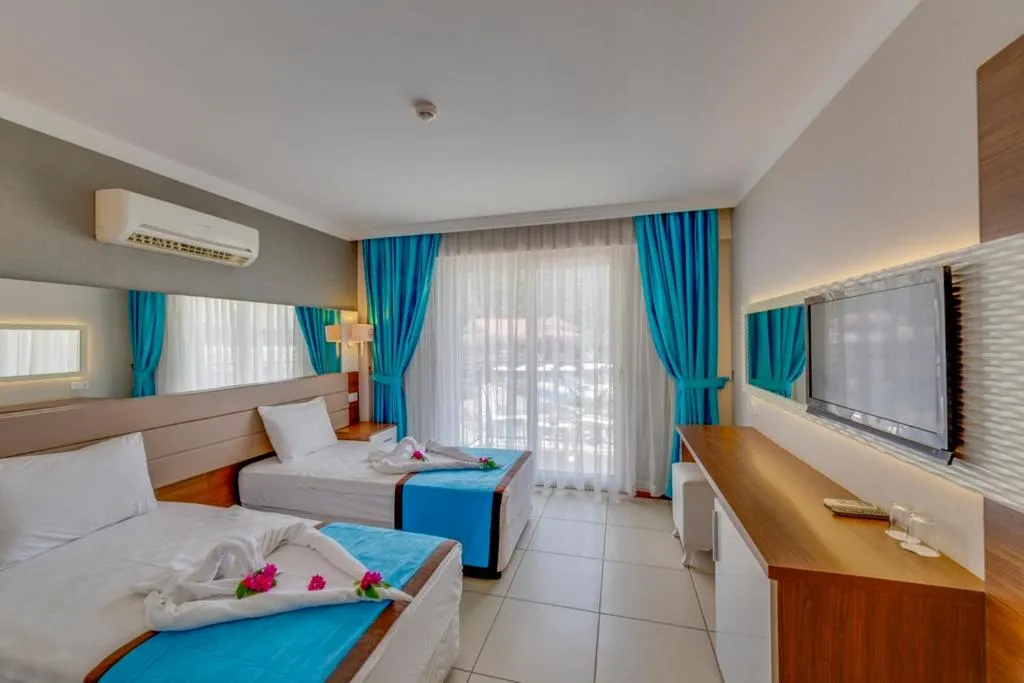 Bed in Marcan Resort Hotel