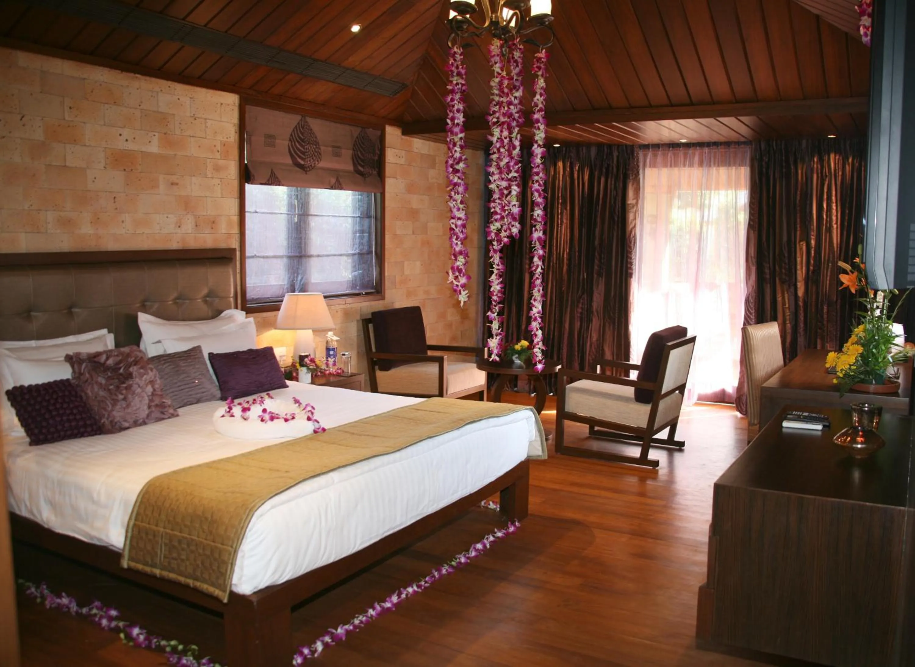 Photo of the whole room, Bed in Madhubhan Resort & Spa