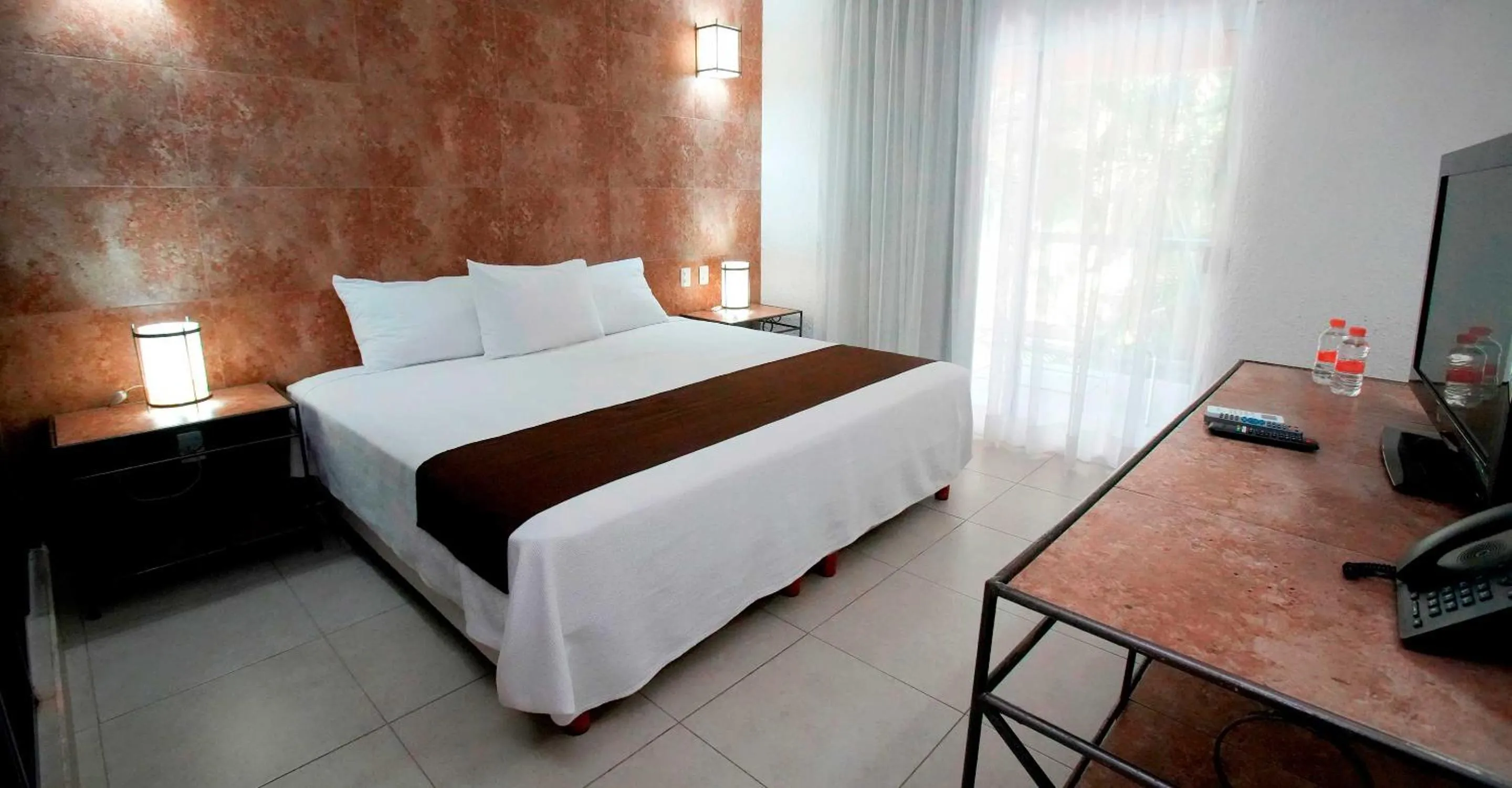 Bed in Tukan Hotel Playa del Carmen