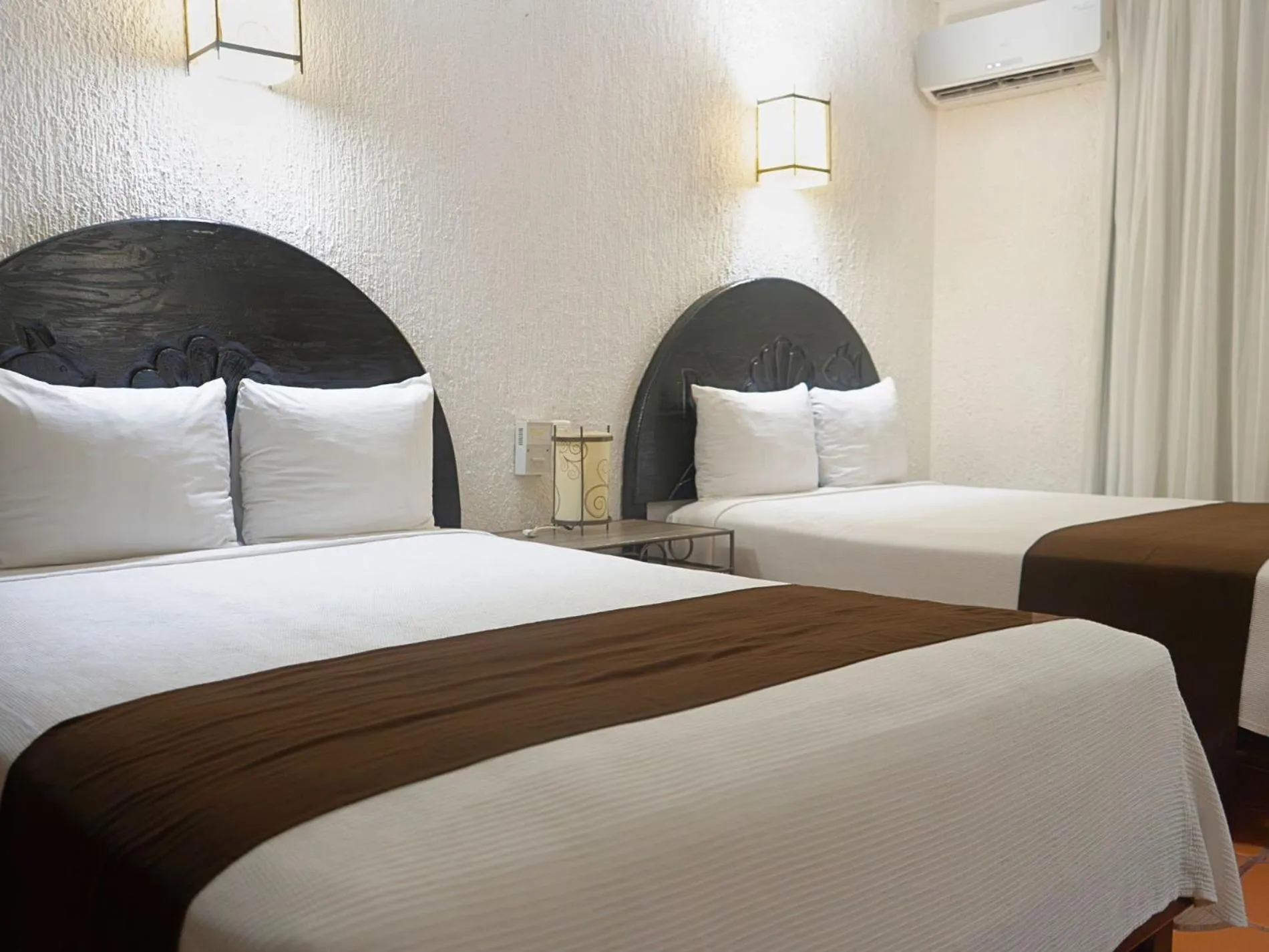 Bed in Tukan Hotel Playa del Carmen