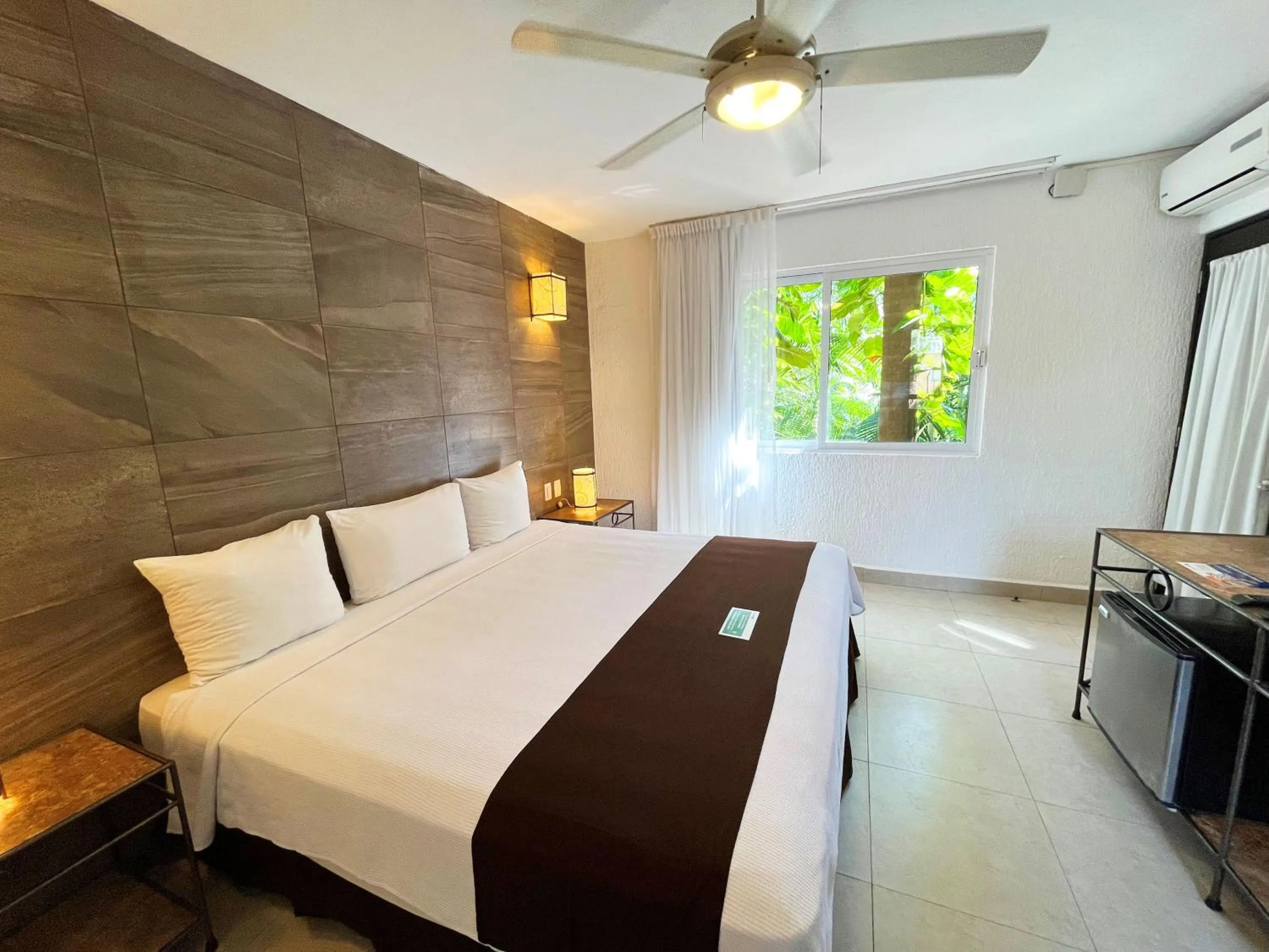 Bed in Tukan Hotel Playa del Carmen