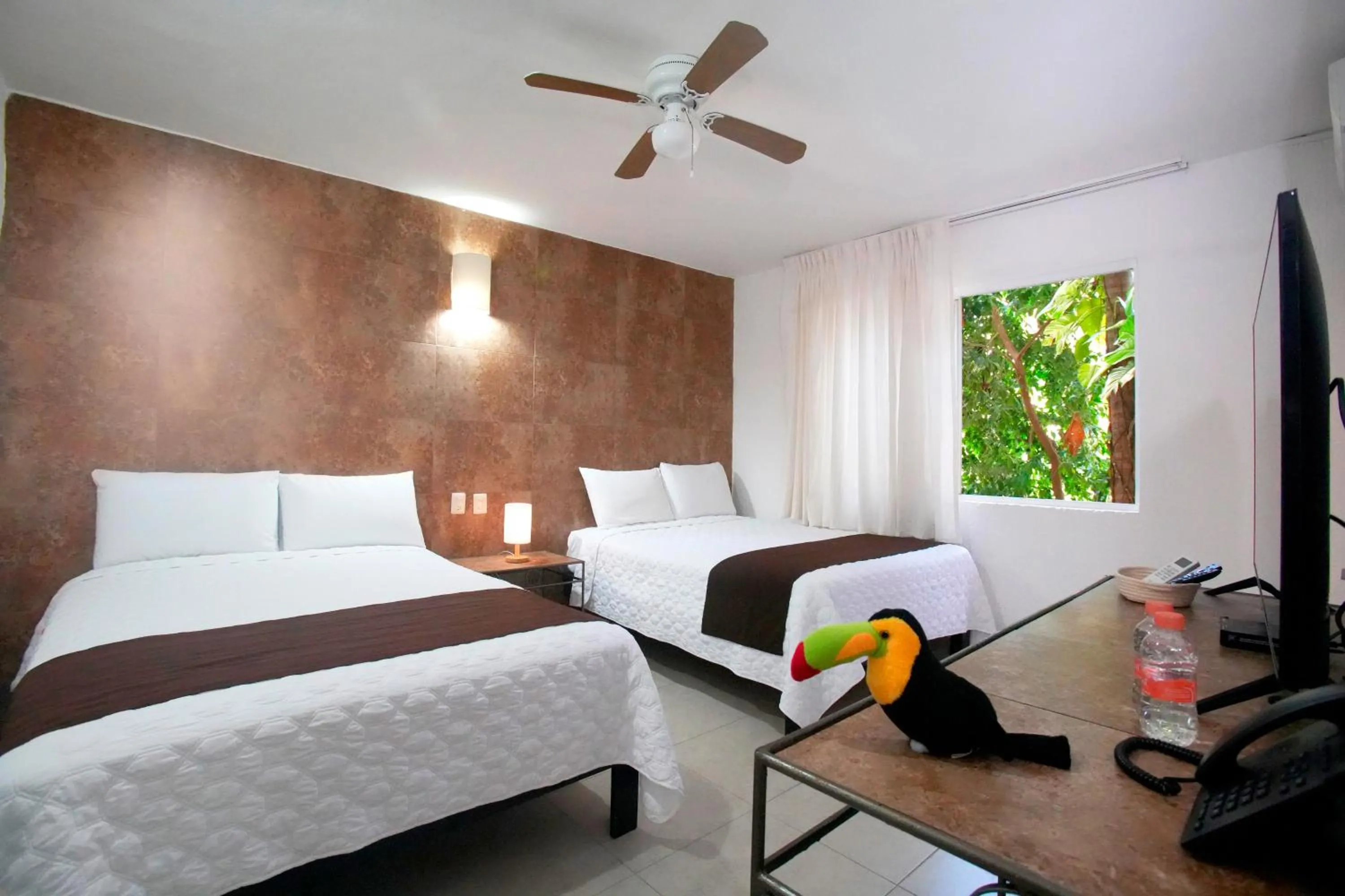 Bed in Tukan Hotel Playa del Carmen