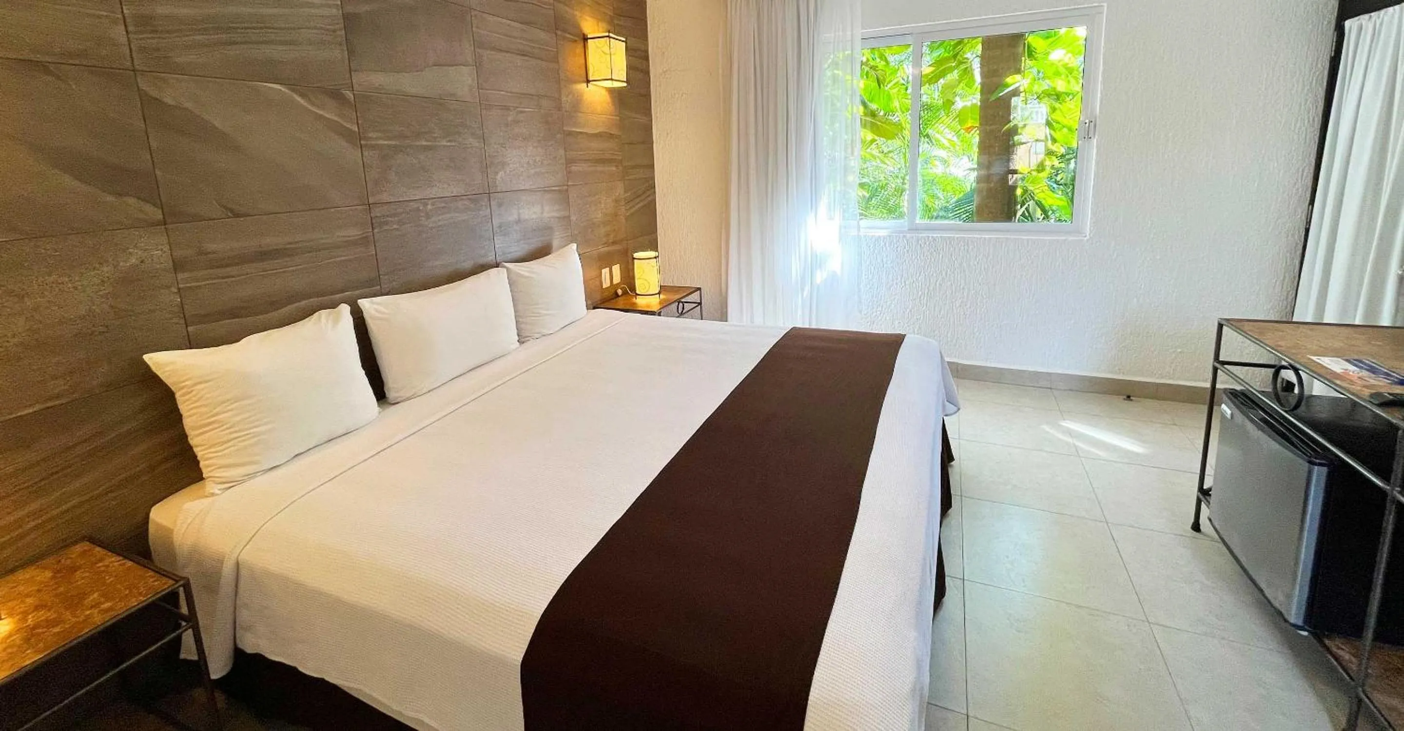 Bed in Tukan Hotel Playa del Carmen