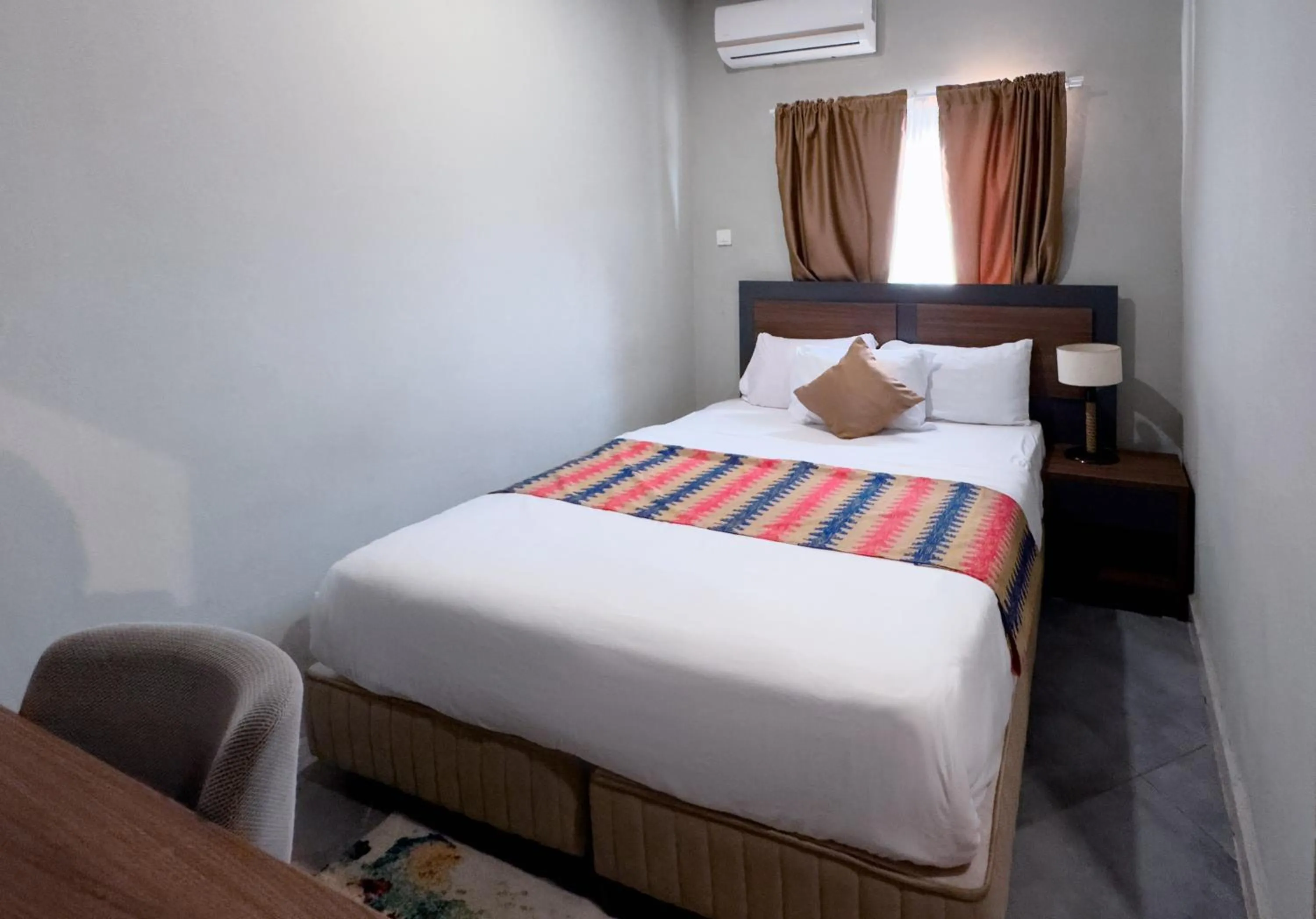 Bed in Euro Homes Hotel