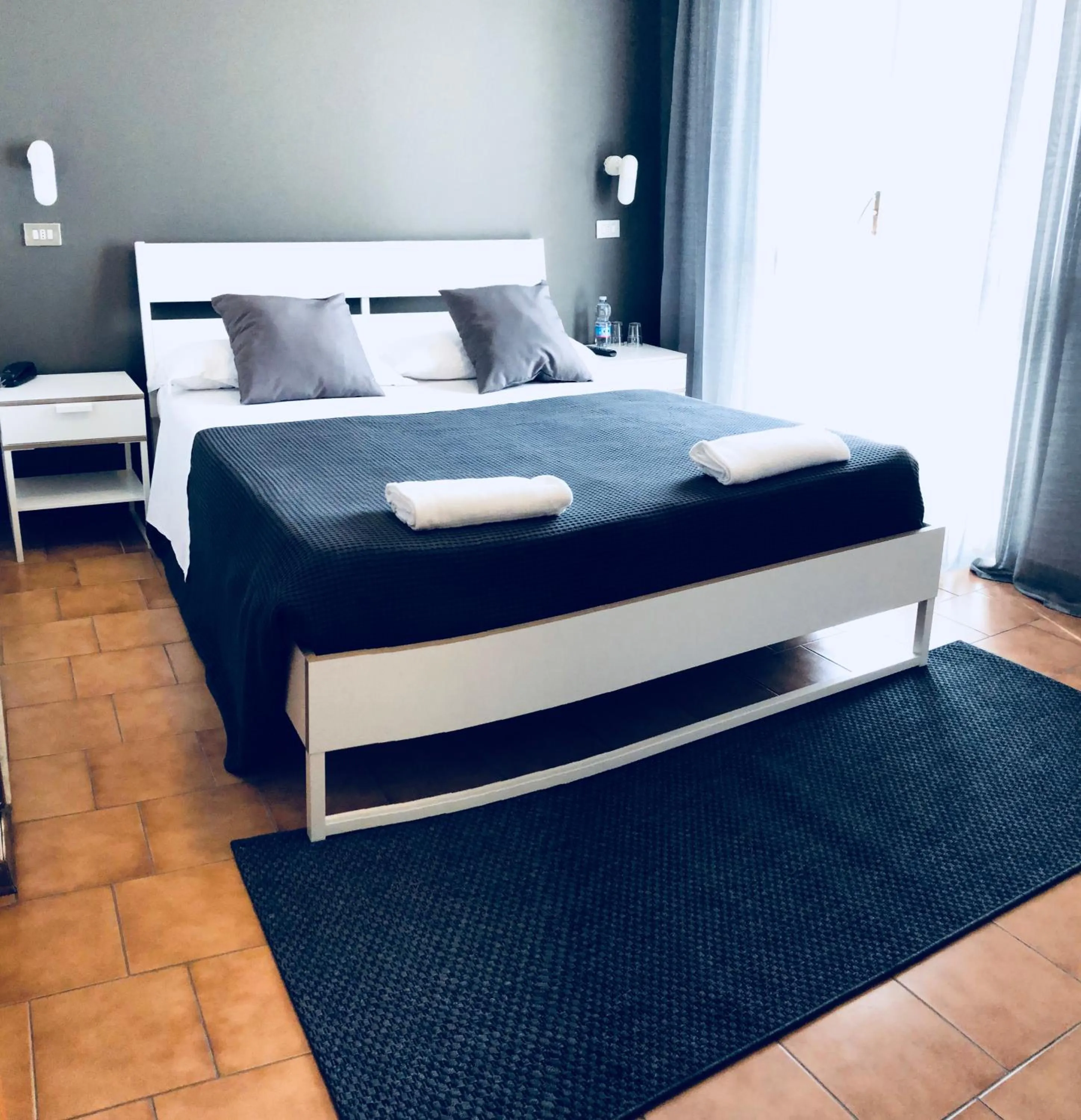 Bed in Hotel Aplo - Breakfast Experience