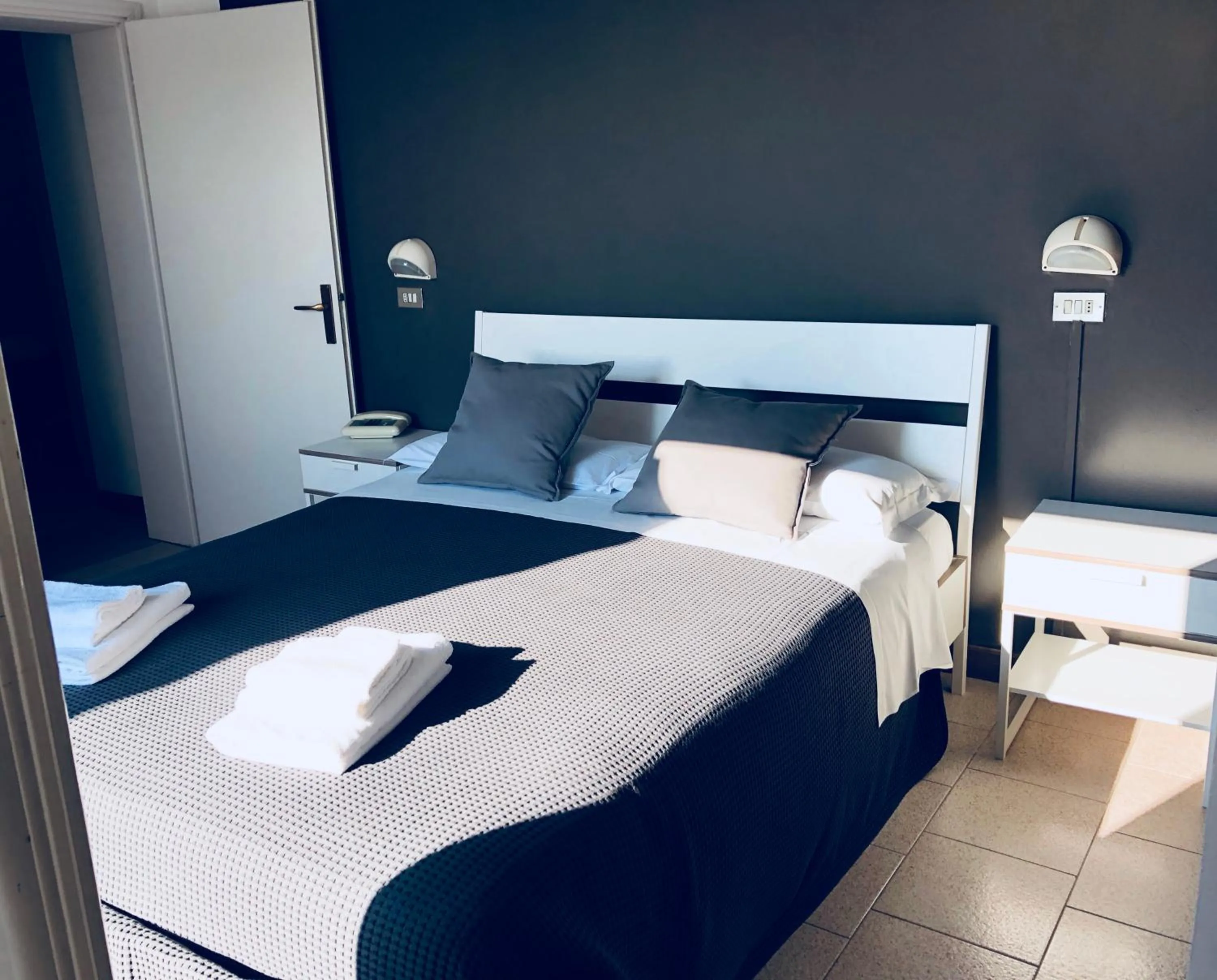 Bed in Hotel Aplo - Breakfast Experience