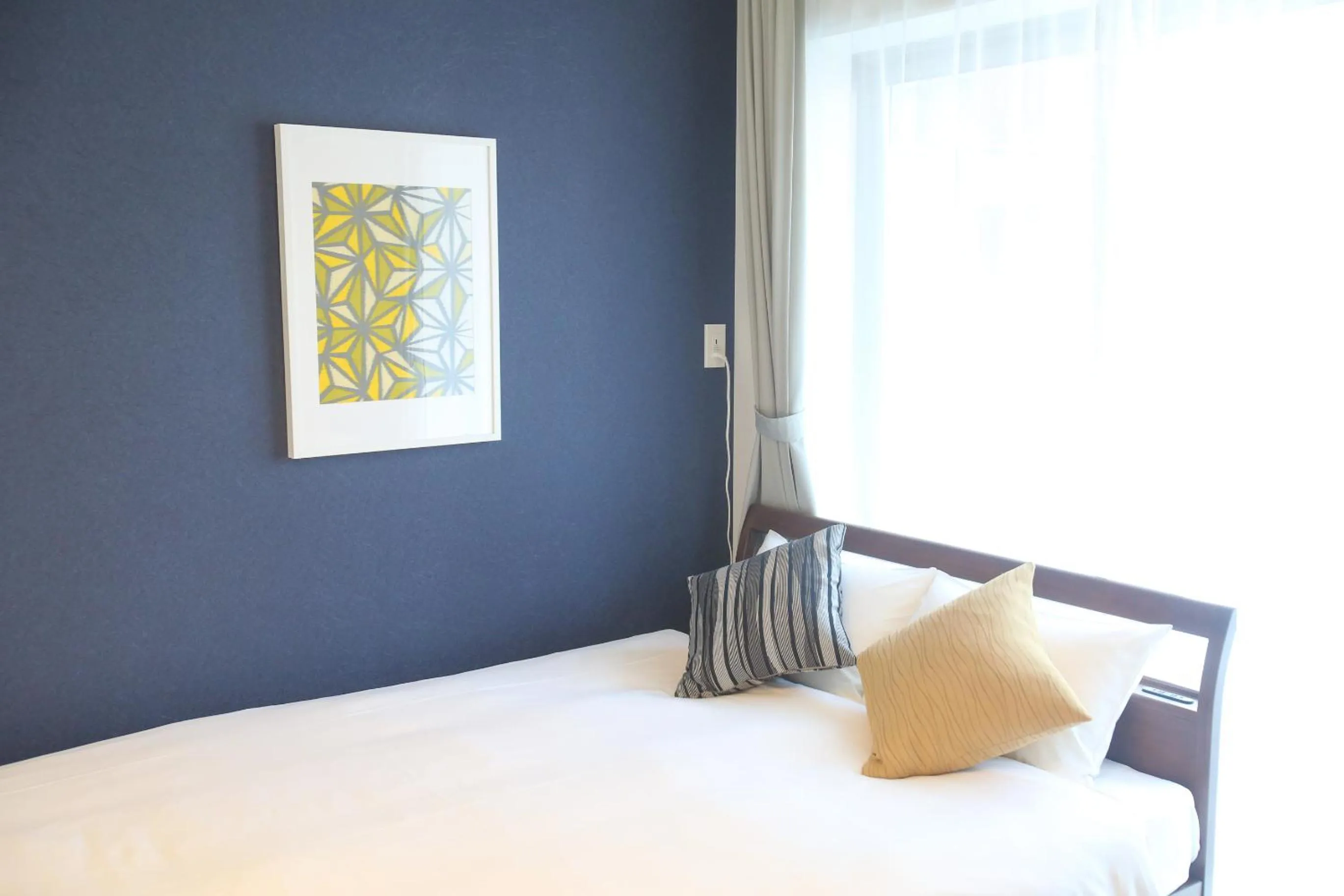 Bed in Apartment Hotel Tenjin TUMUGU