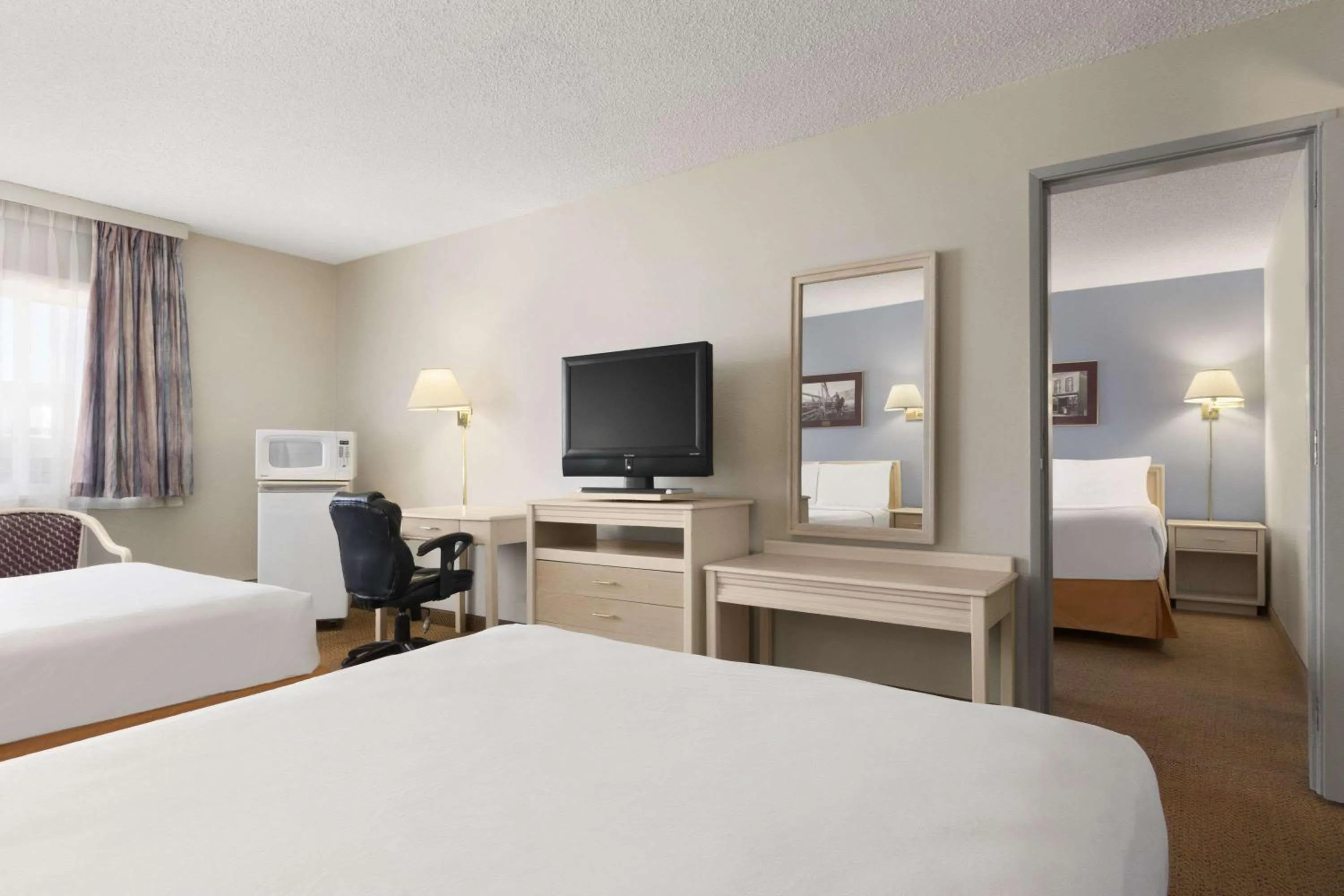 Bedroom in Travelodge by Wyndham Calgary South