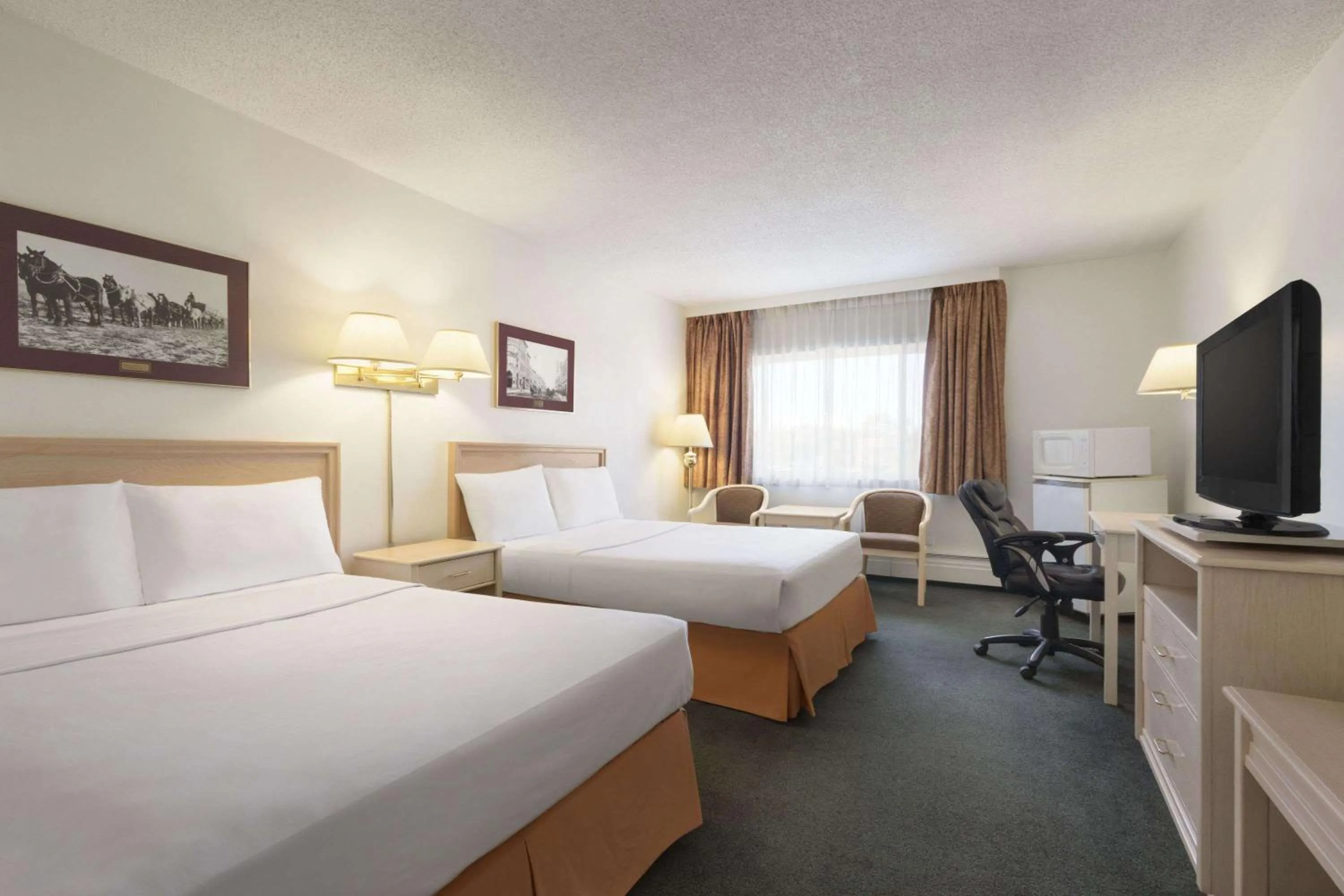Bedroom in Travelodge by Wyndham Calgary South