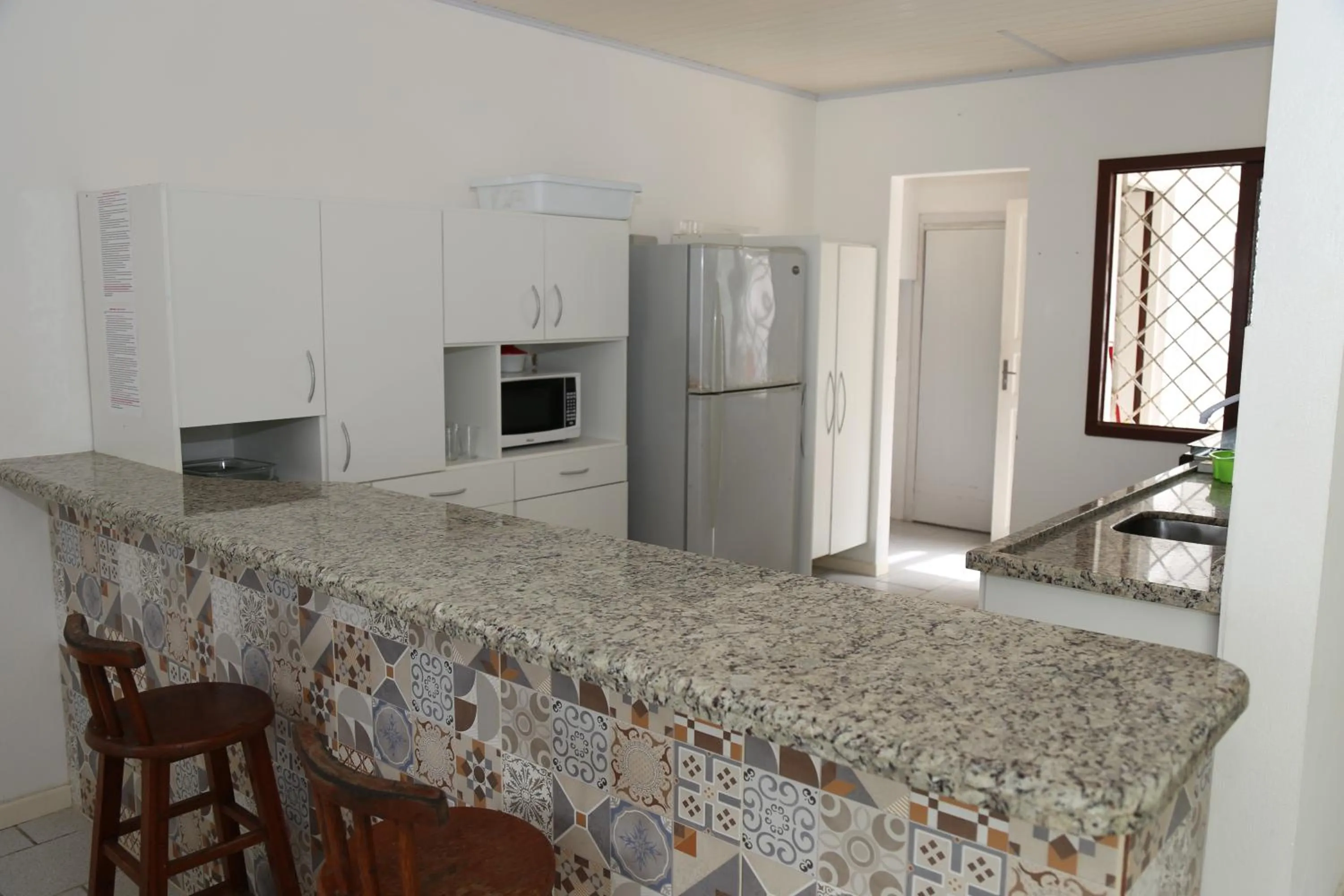 Kitchen or kitchenette in Pousada Oceânica