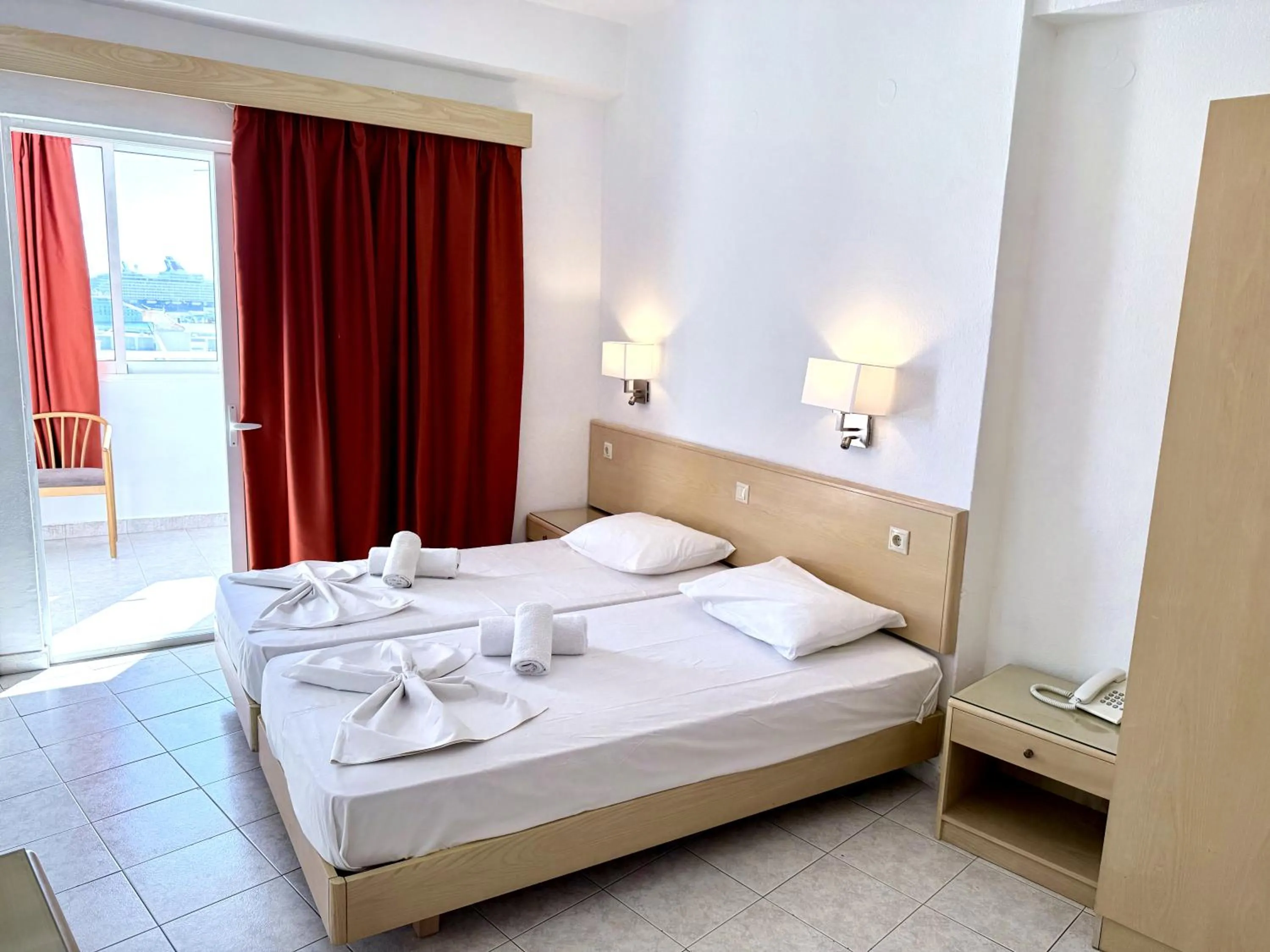 Bed in Savoy City Hotel