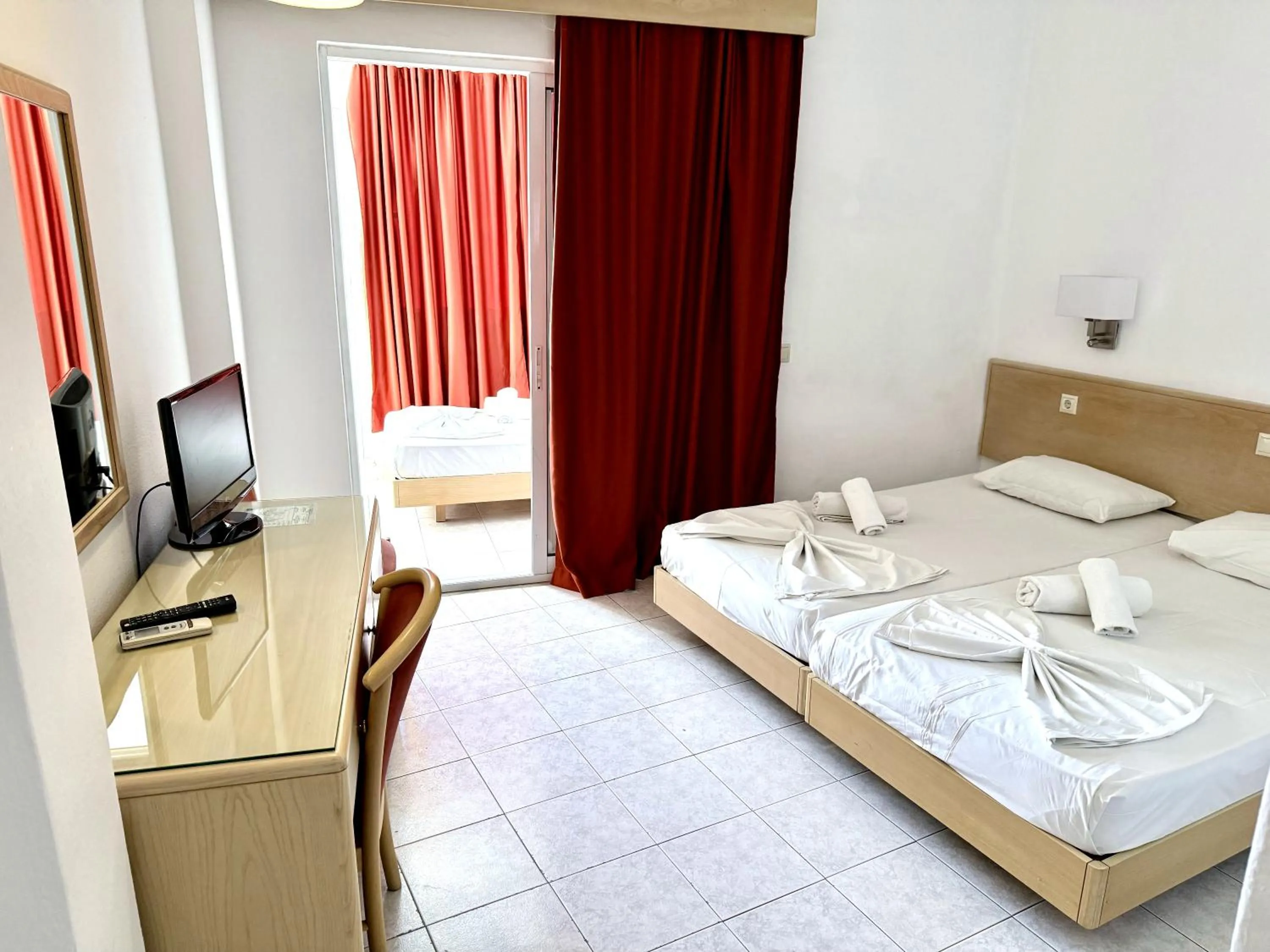 Bed in Savoy City Hotel