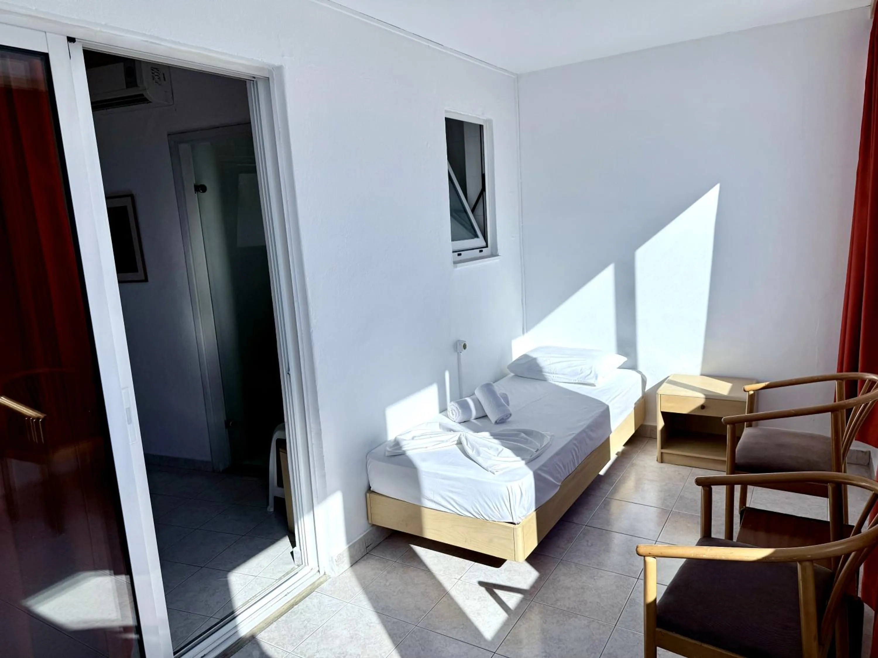 Bed in Savoy City Hotel