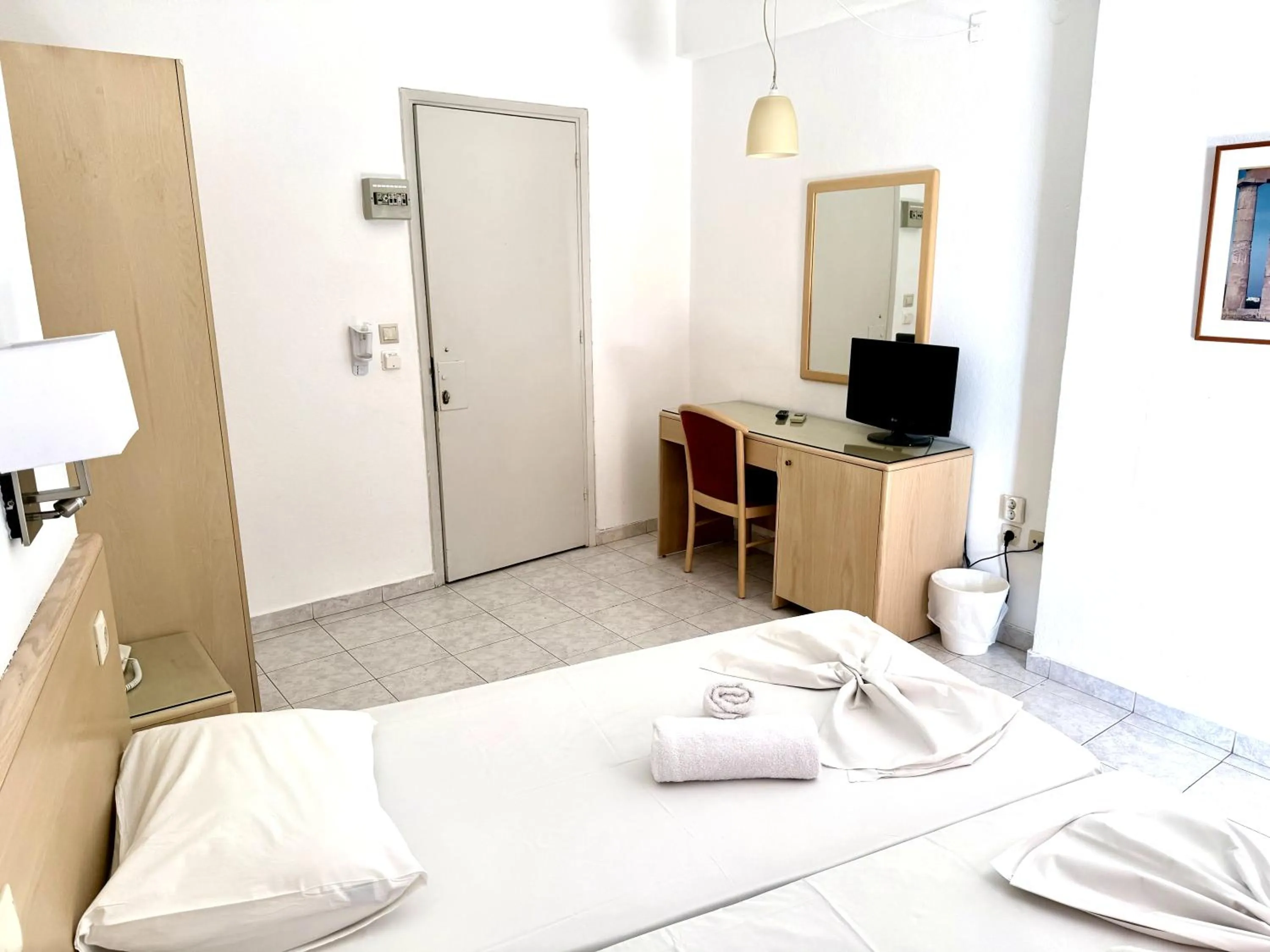 Bed in Savoy City Hotel