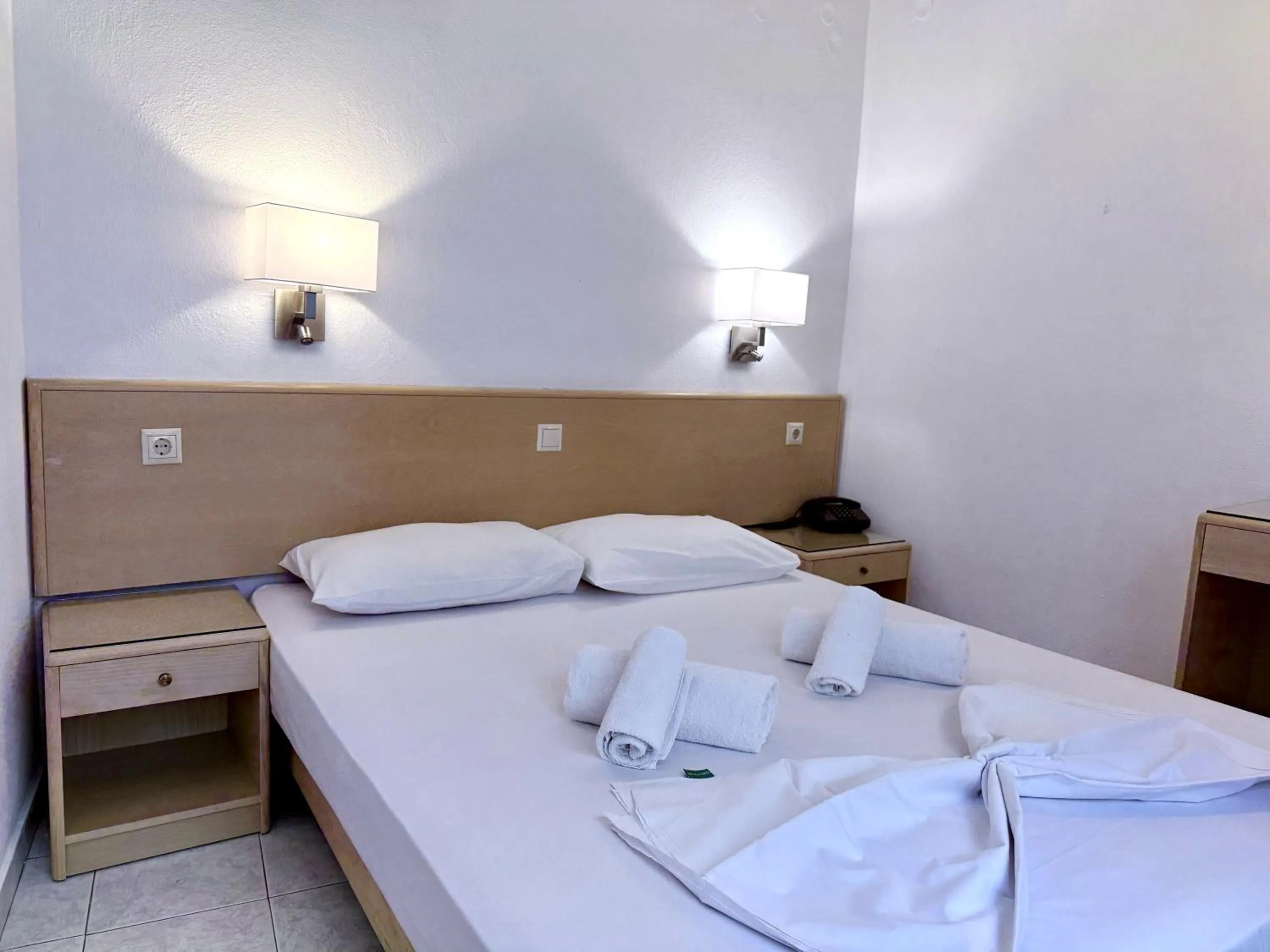 Bed in Savoy City Hotel