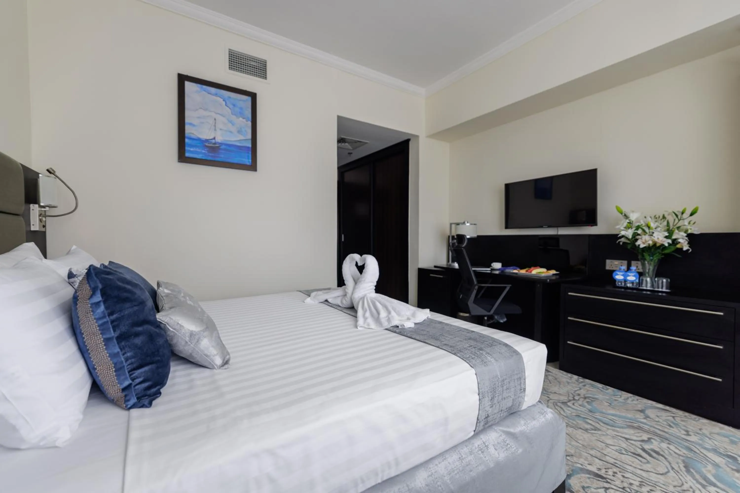 Bed in The Royal Riviera Hotel Doha