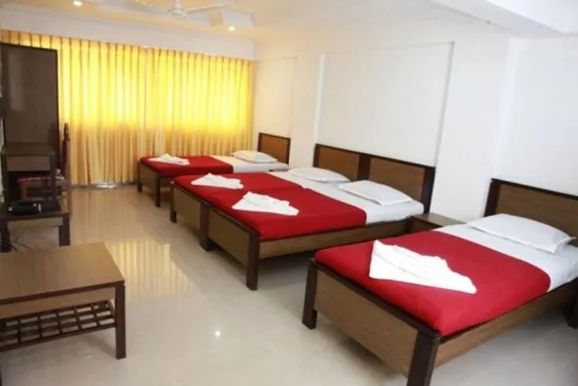 Bed in Saiesh International Hotel