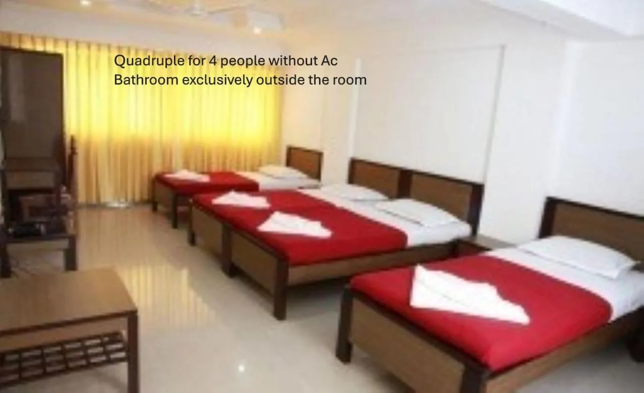 Bed in Saiesh International Hotel