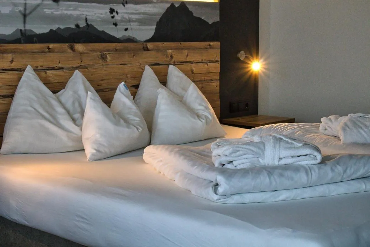 Seating area, Bed in Hotel Achentalerhof