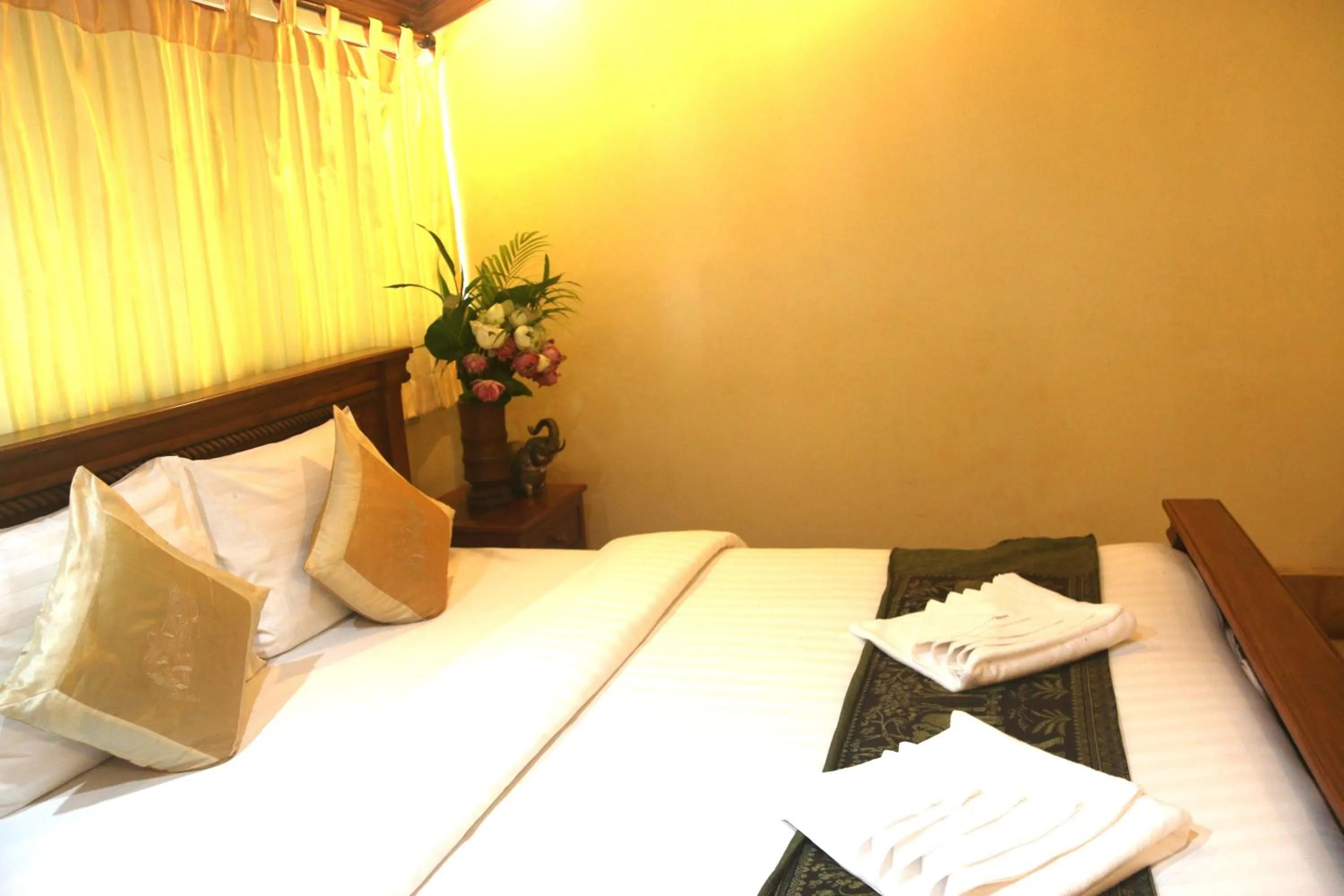 Bed in Shining Angkor Apartment Hotel
