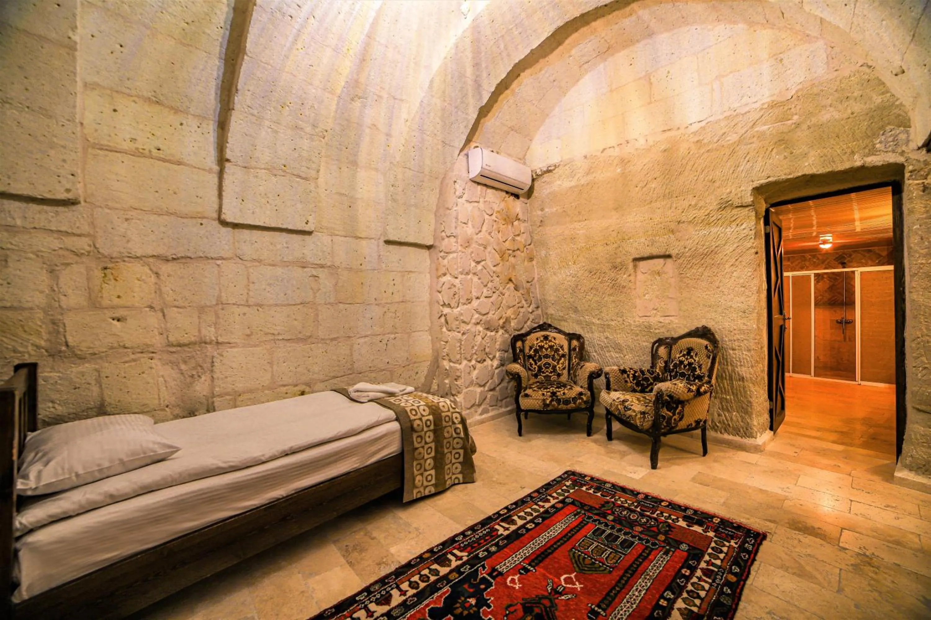 Living room, Bed in Cappadocia Caves Hotel