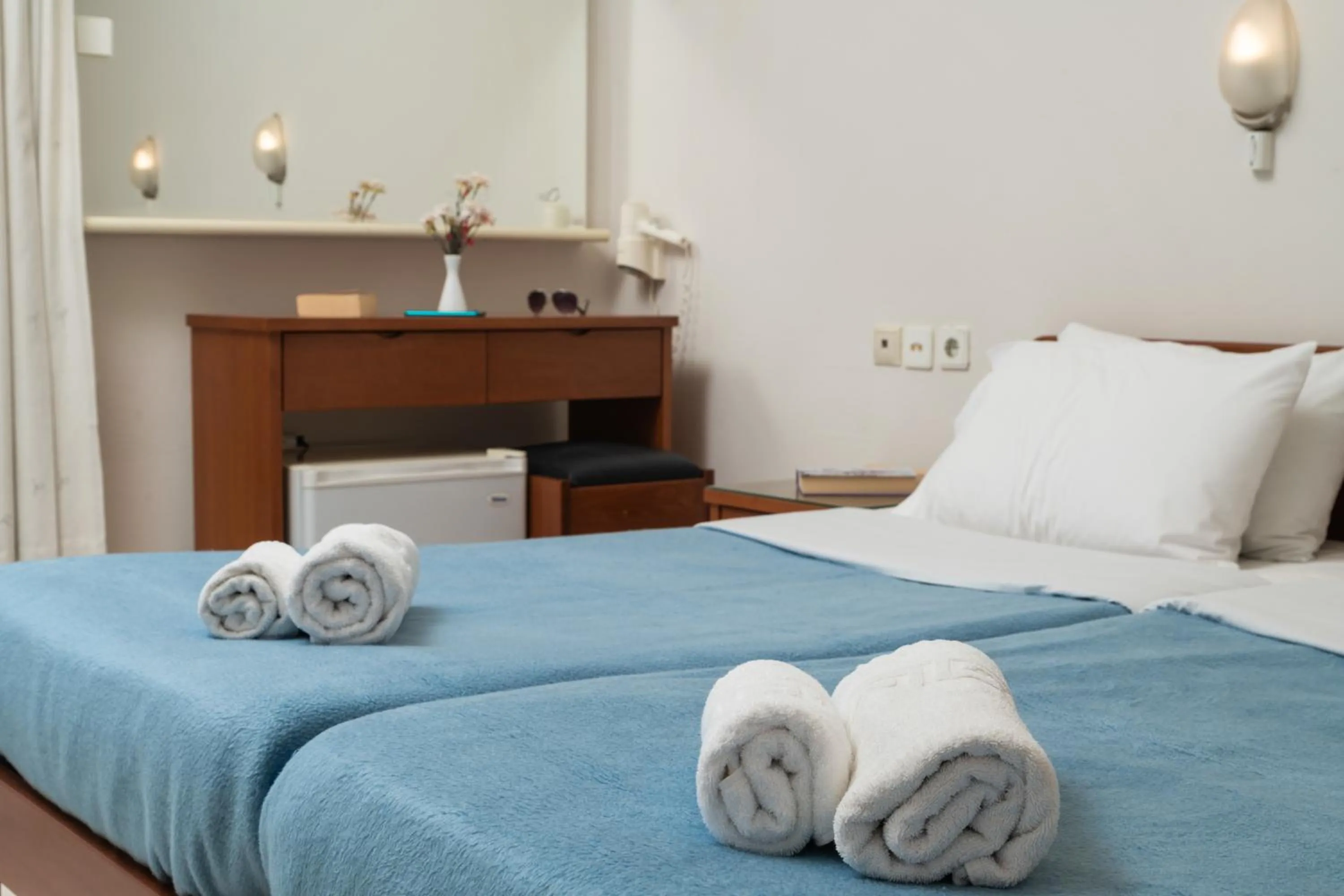 Bed in Hotel Haris on the beach