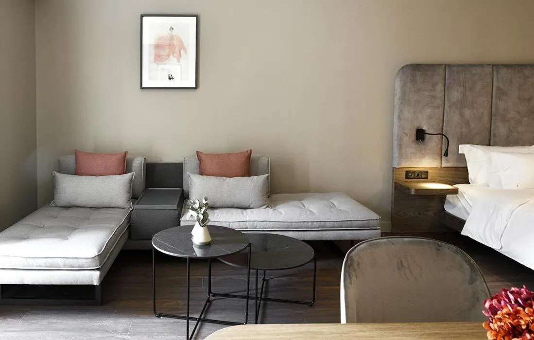 Living room, Bed in Roomore Apartments