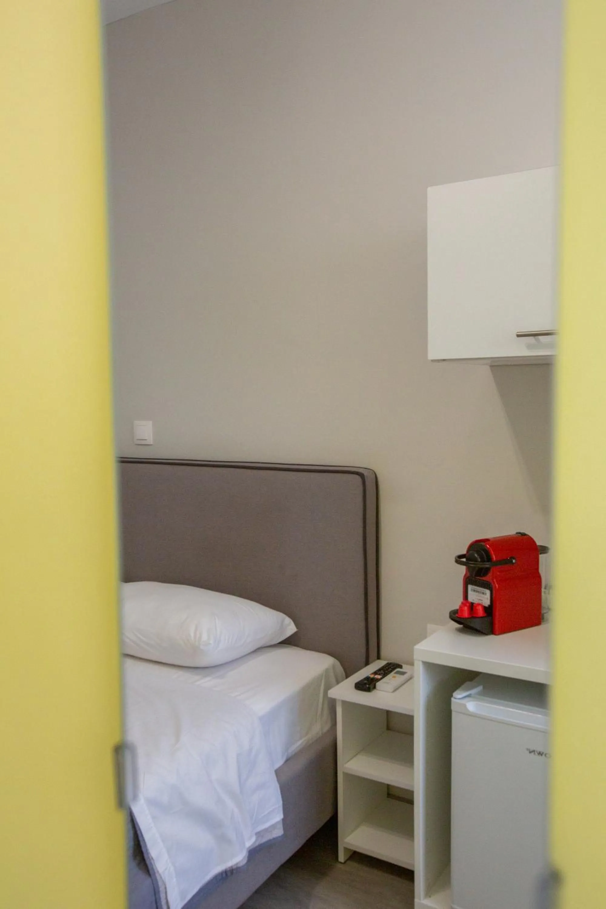 Bed in Raise Boutique Rooms in the Center of Athens