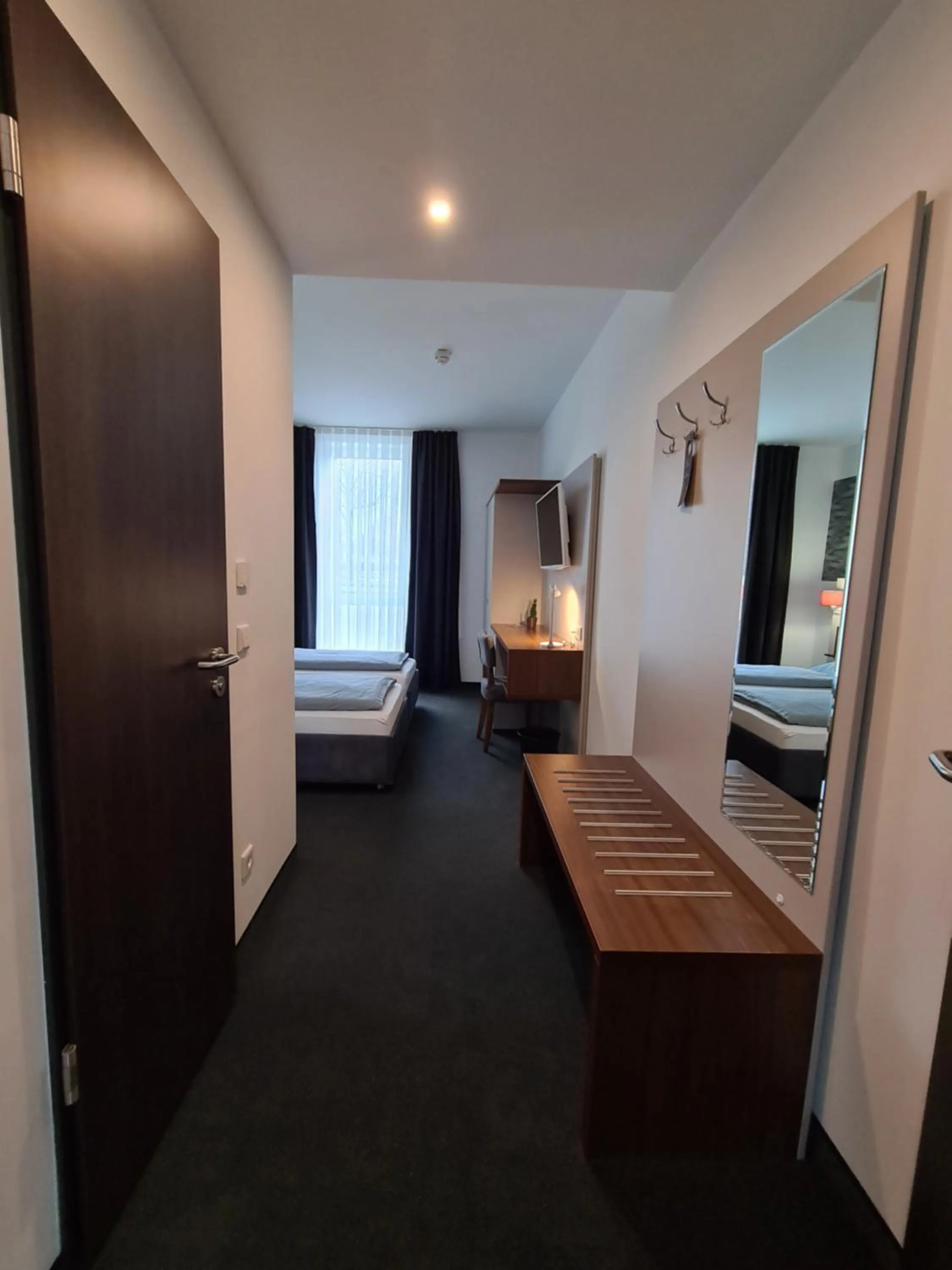 Photo of the whole room, Bed in Hotel Starton am Ingolstadt Village