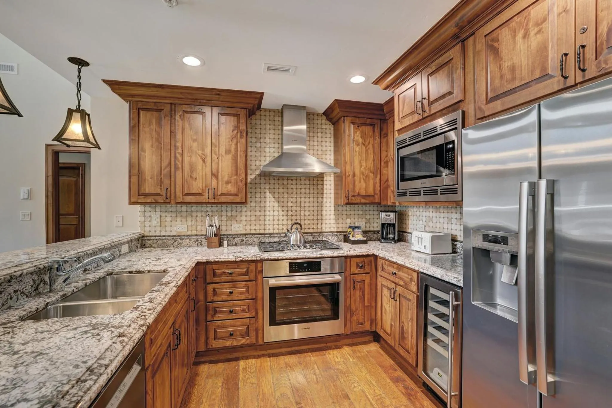 Communal kitchen in Legendary Lodging at the Ritz Carlton Residences Vail, A Vail Resorts Property