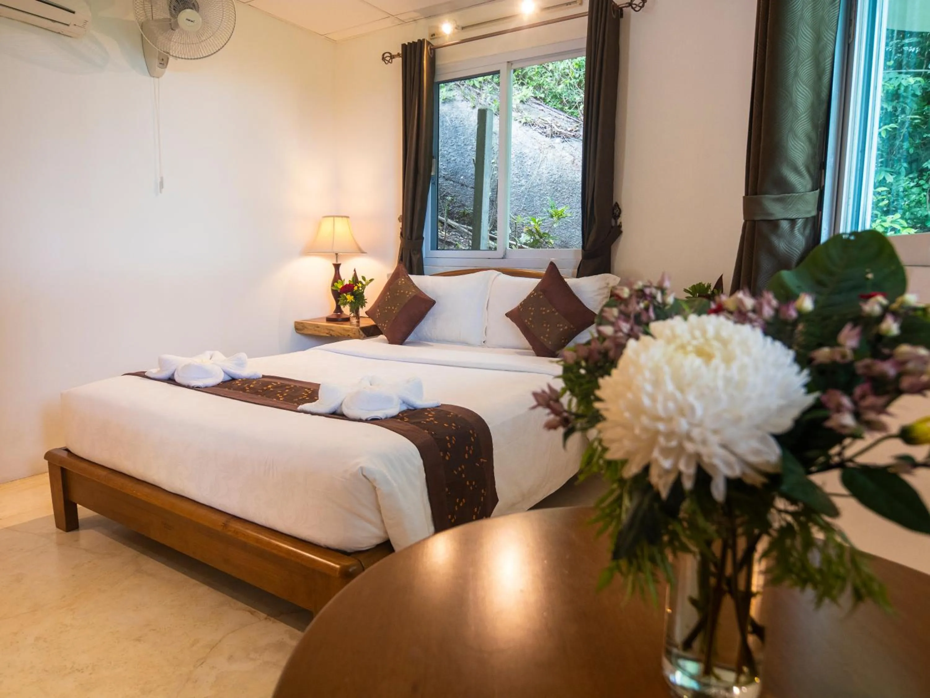 Bed in Monkey Flower Villas