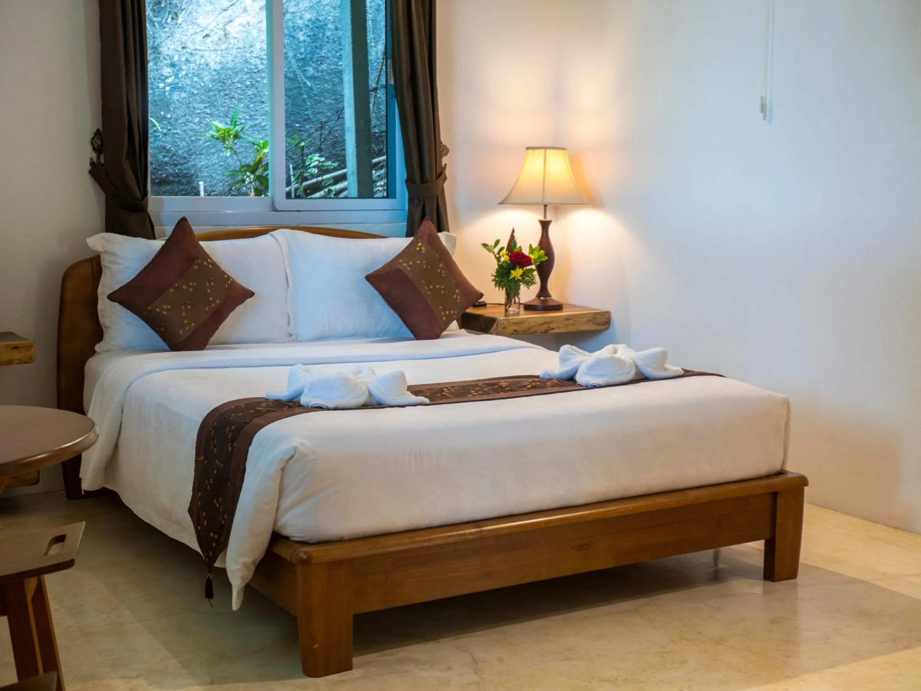 Bed in Monkey Flower Villas