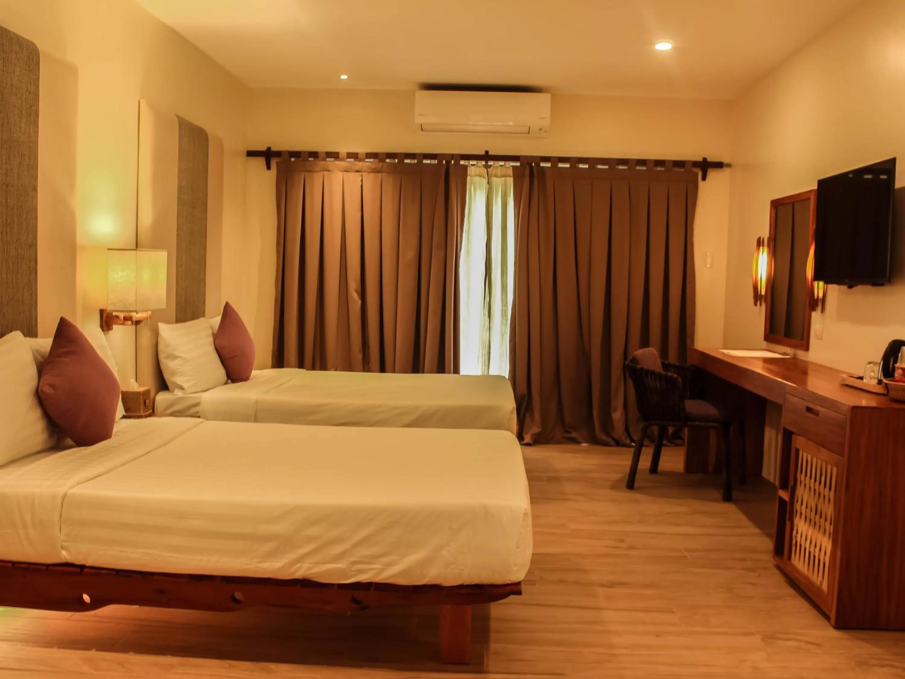 Bed in Bluewater Panglao Beach Resort