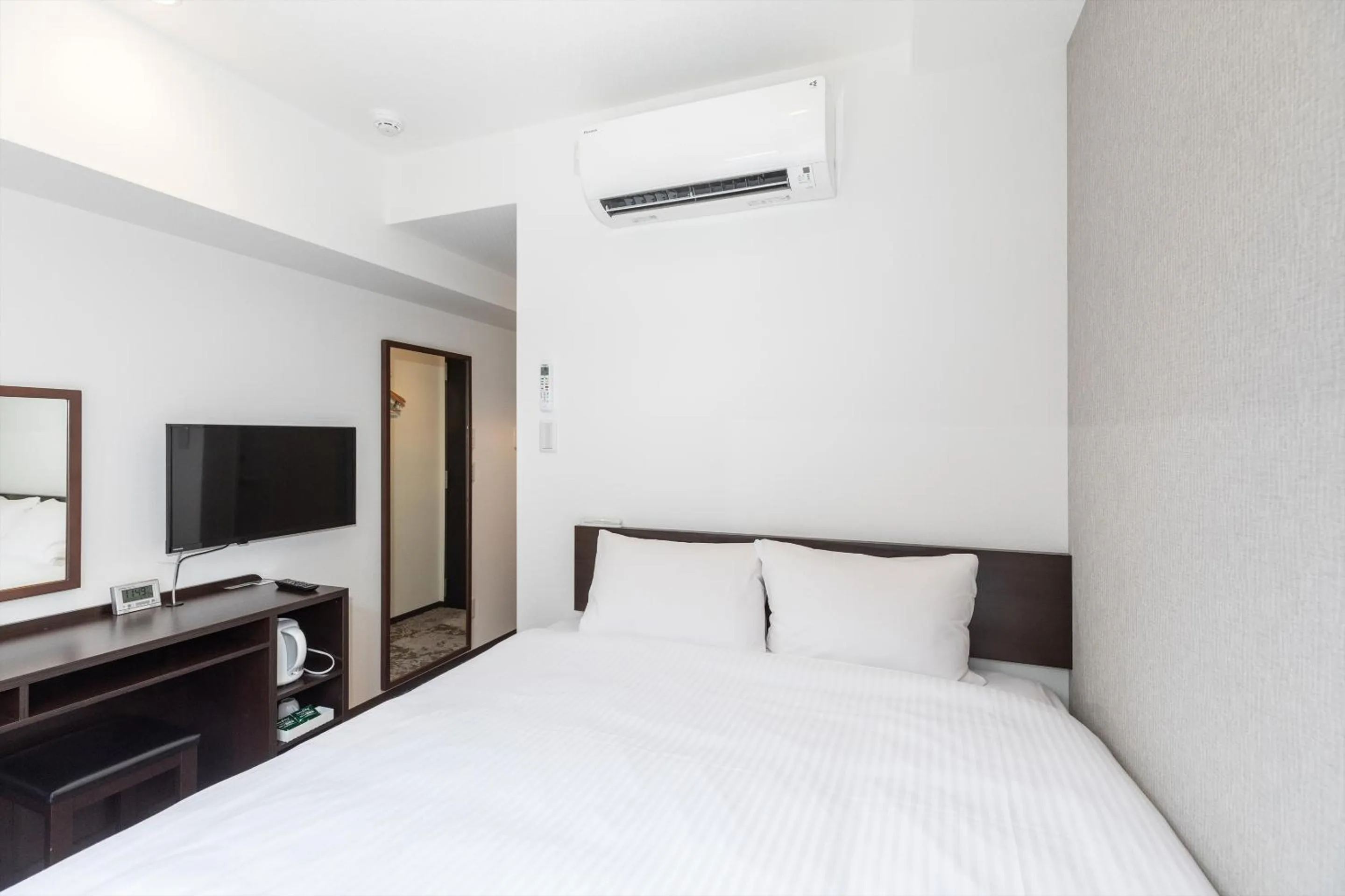 Bed in Hotel Tetora Kyoto Station