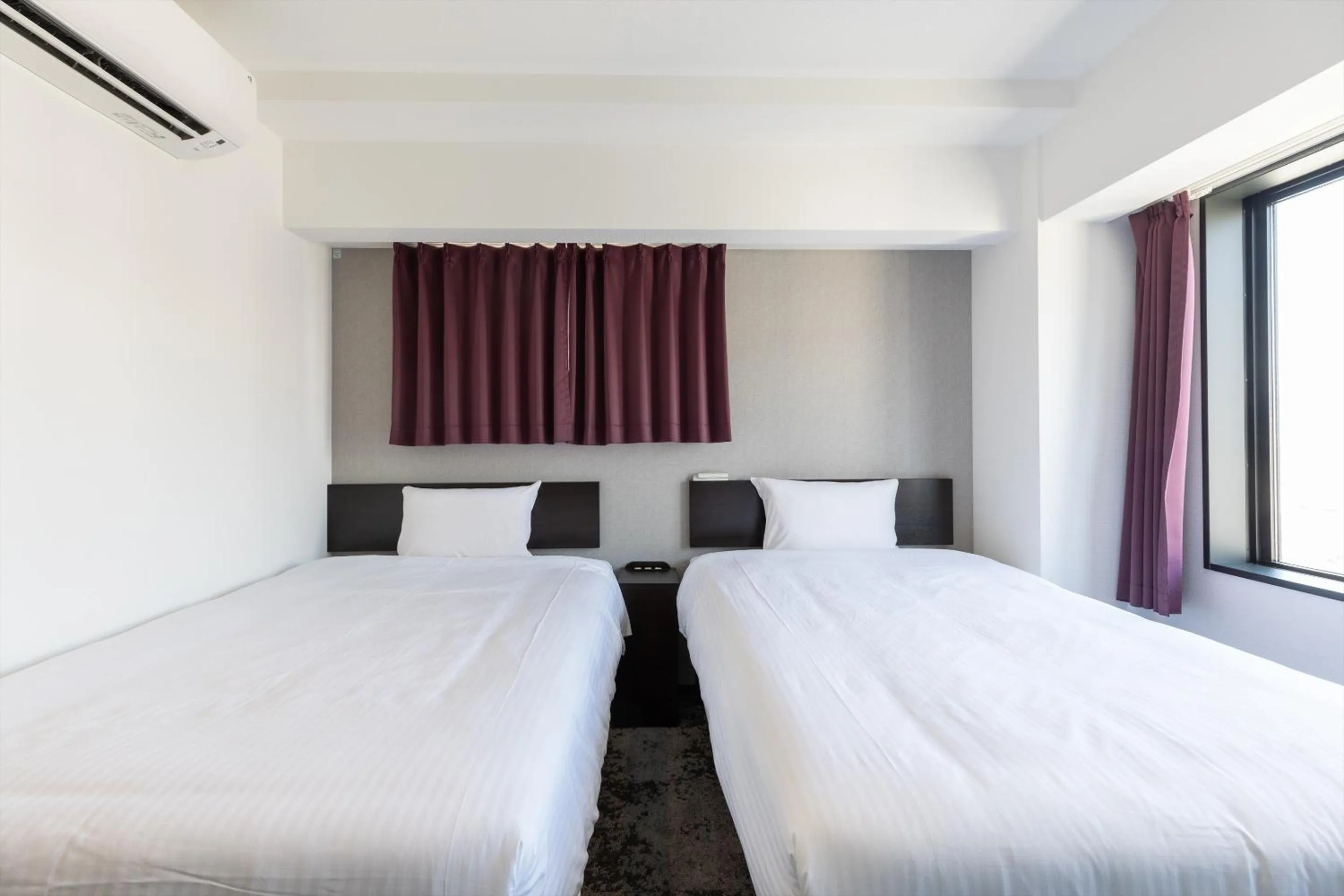 Bed in Hotel Tetora Kyoto Station