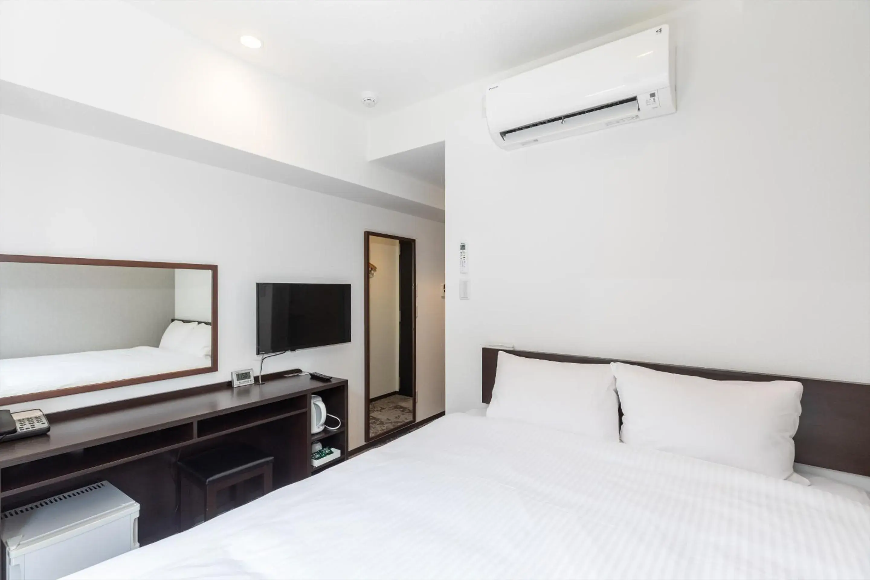 Bed in Hotel Tetora Kyoto Station Bed in Hotel Tetora Kyoto Station