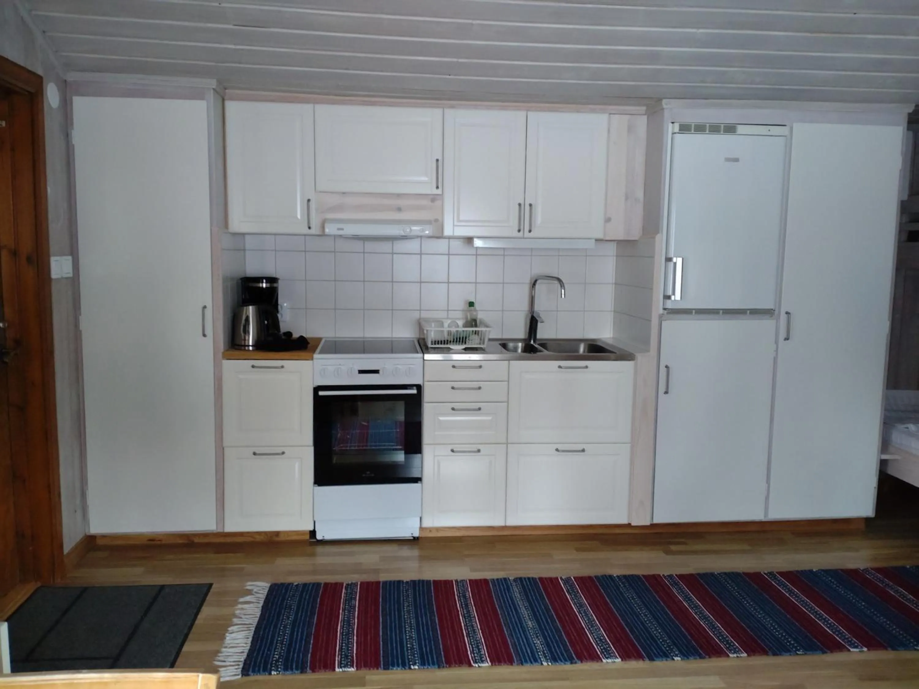 Kitchen or kitchenette in Fyrklöverns Stugby