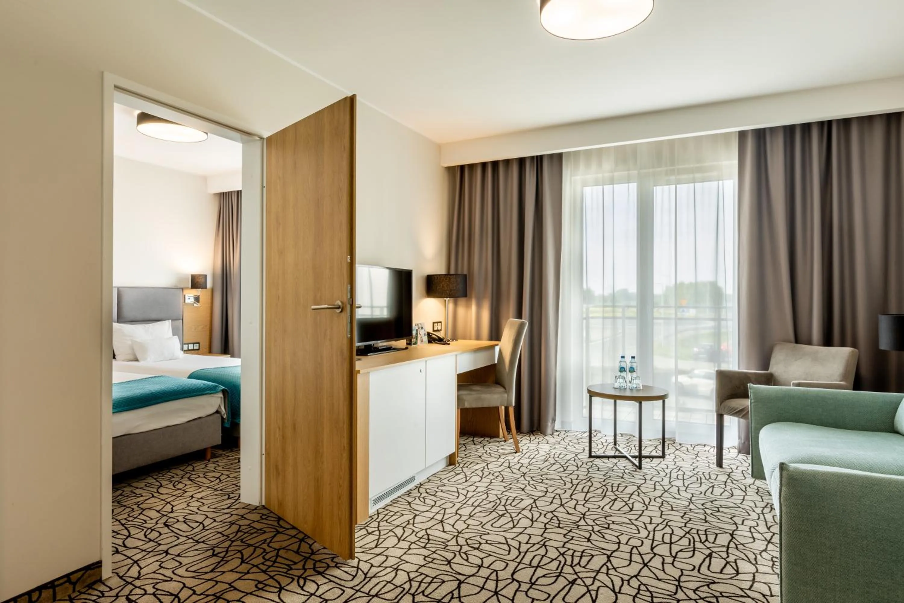 Living room, Bed in Aparthotel Termy Uniejów