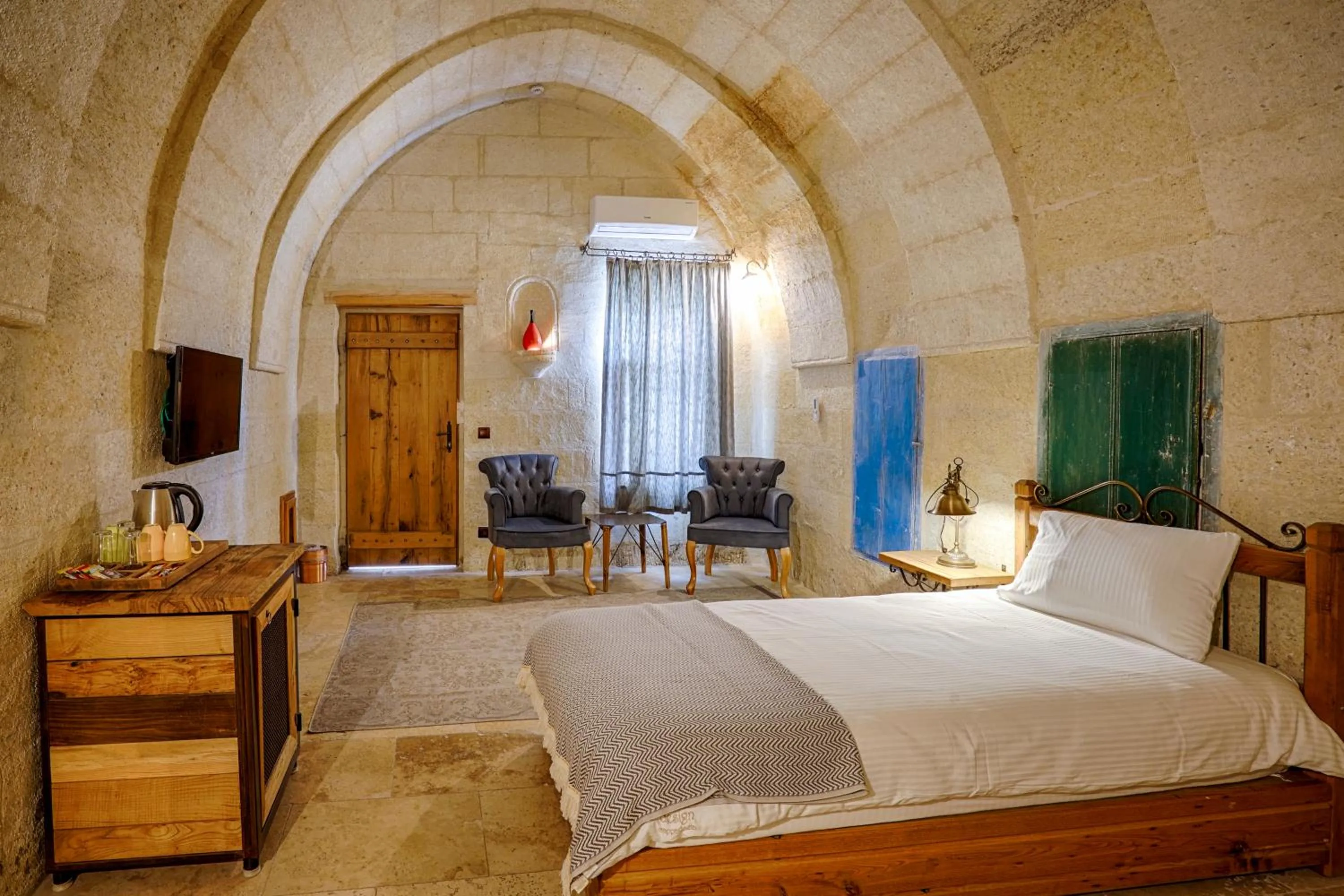 Living room, Bed in Design Cave Hotel