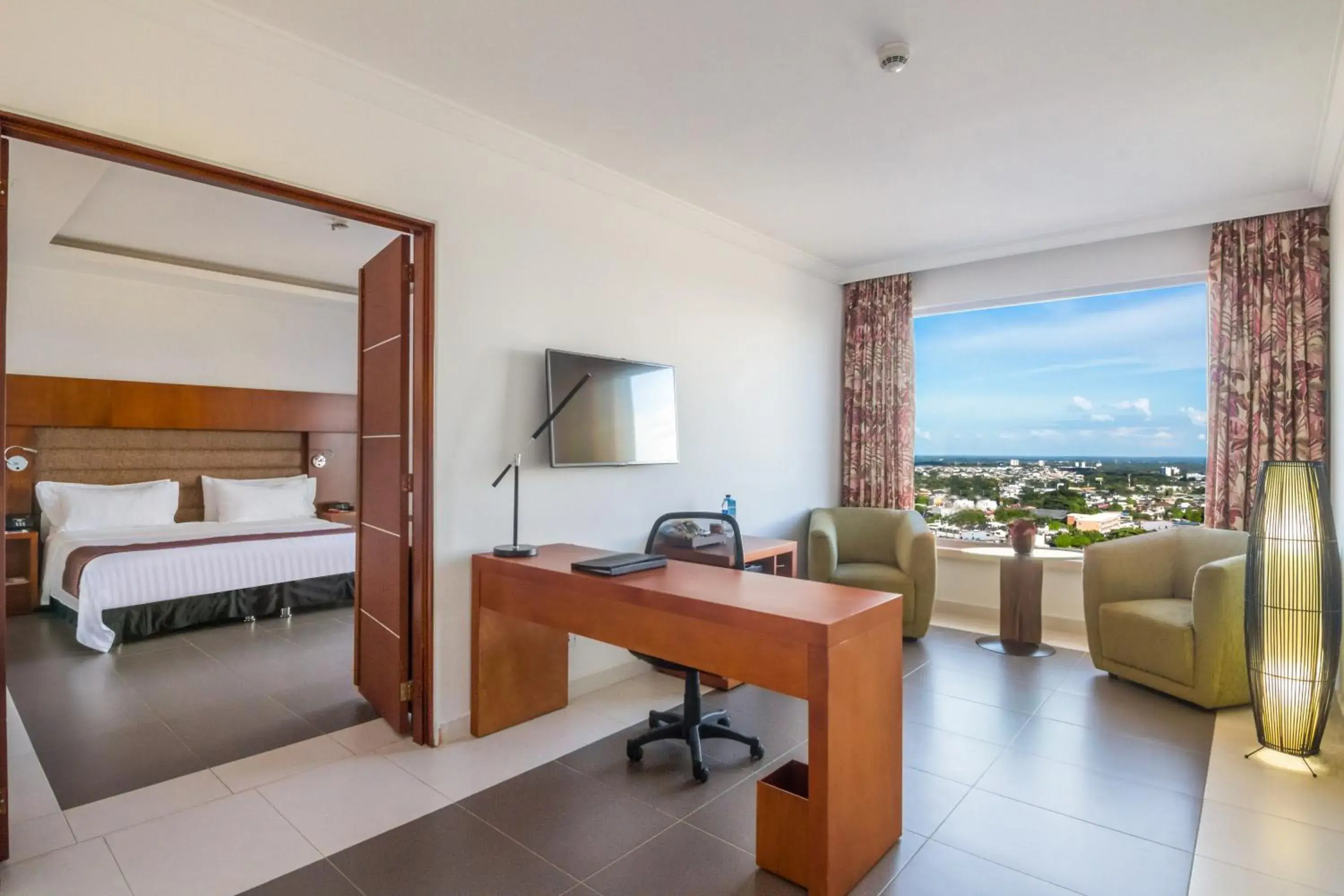 Communal lounge/ TV room, Bed in GHL Hotel Grand Villavicencio Communal lounge/ TV room, Bed in GHL Hotel Grand Villavicencio