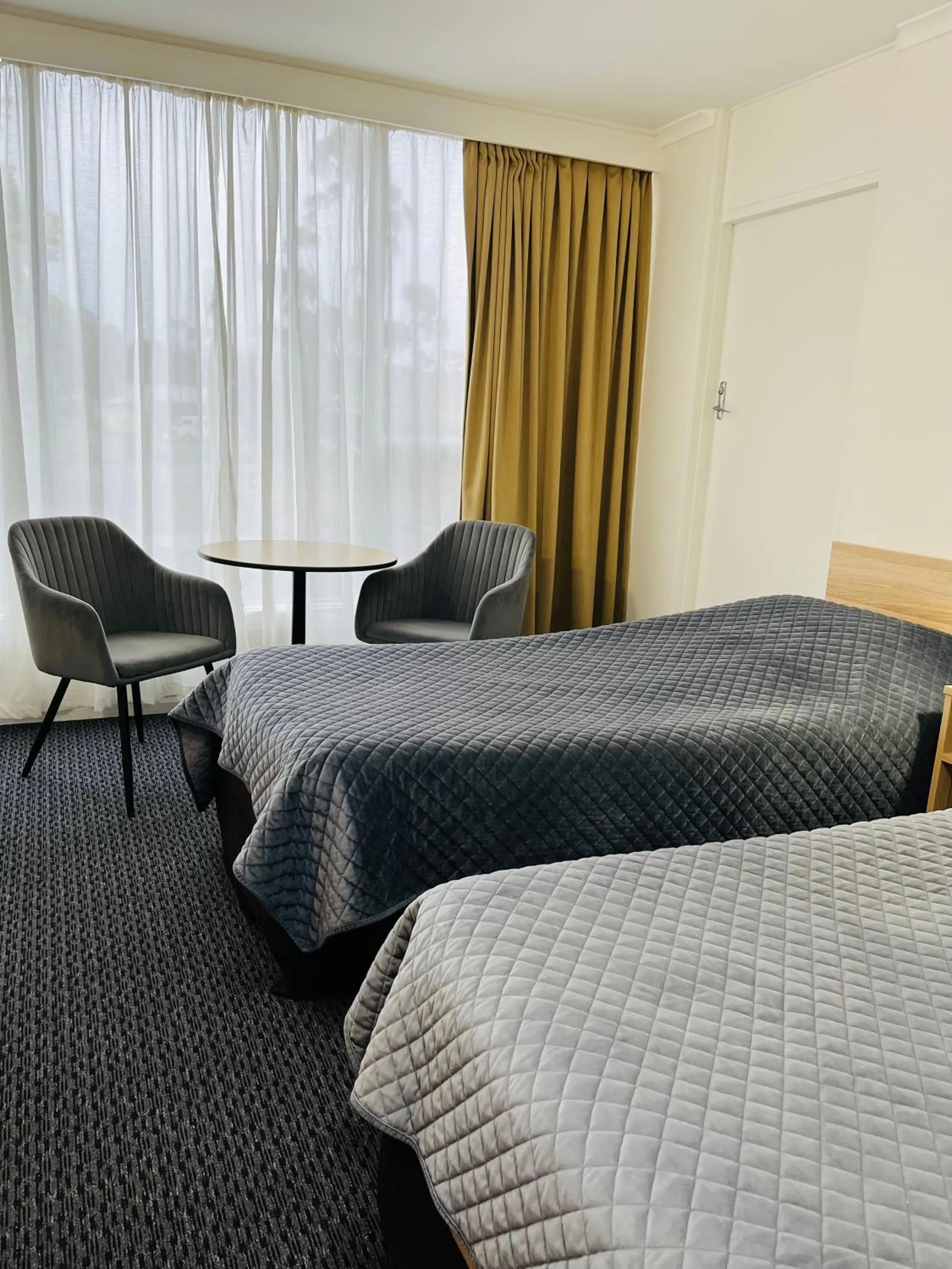 Bed in Heemskirk Motor Hotel