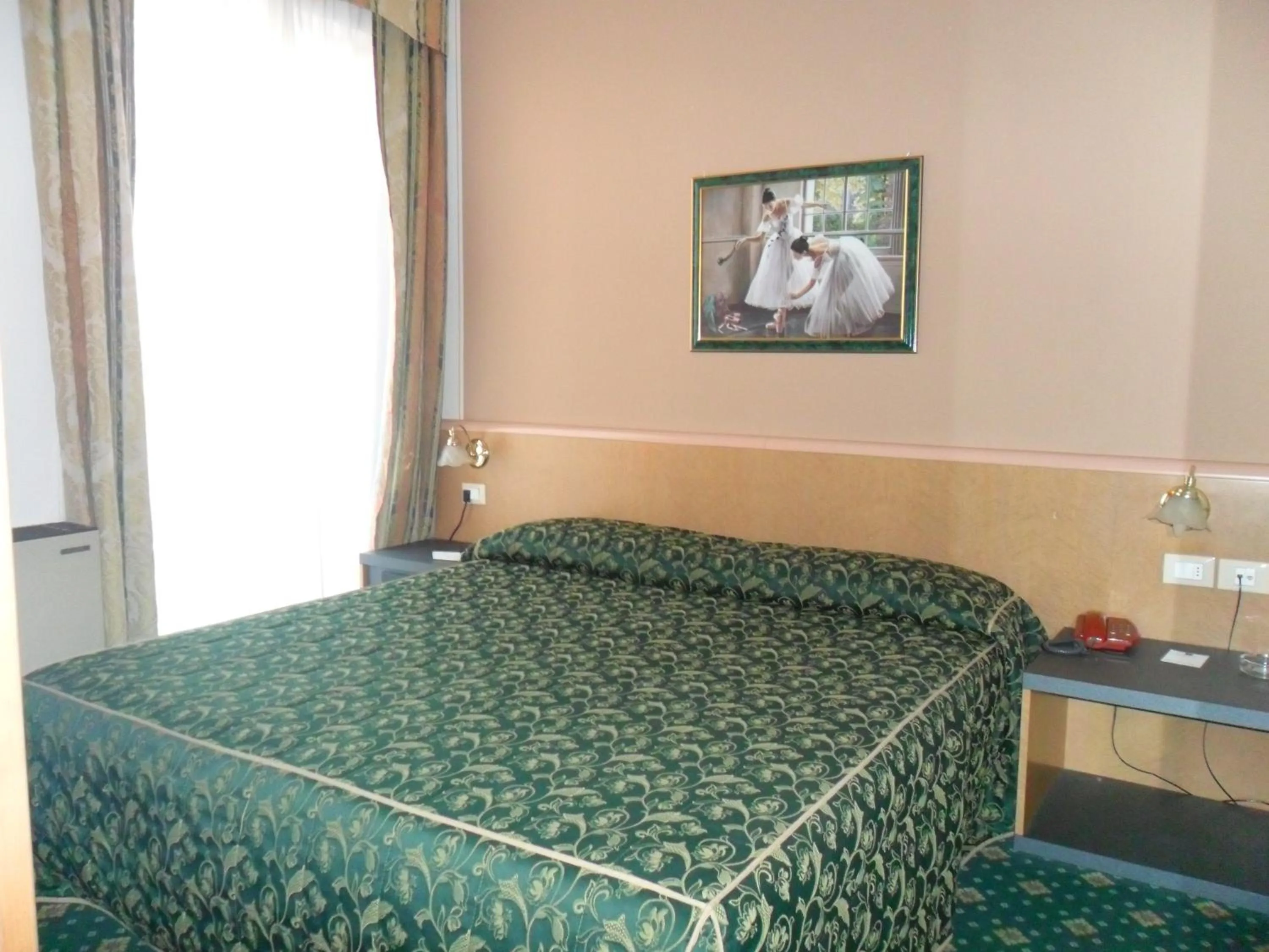 Bed in Hotel Riviera