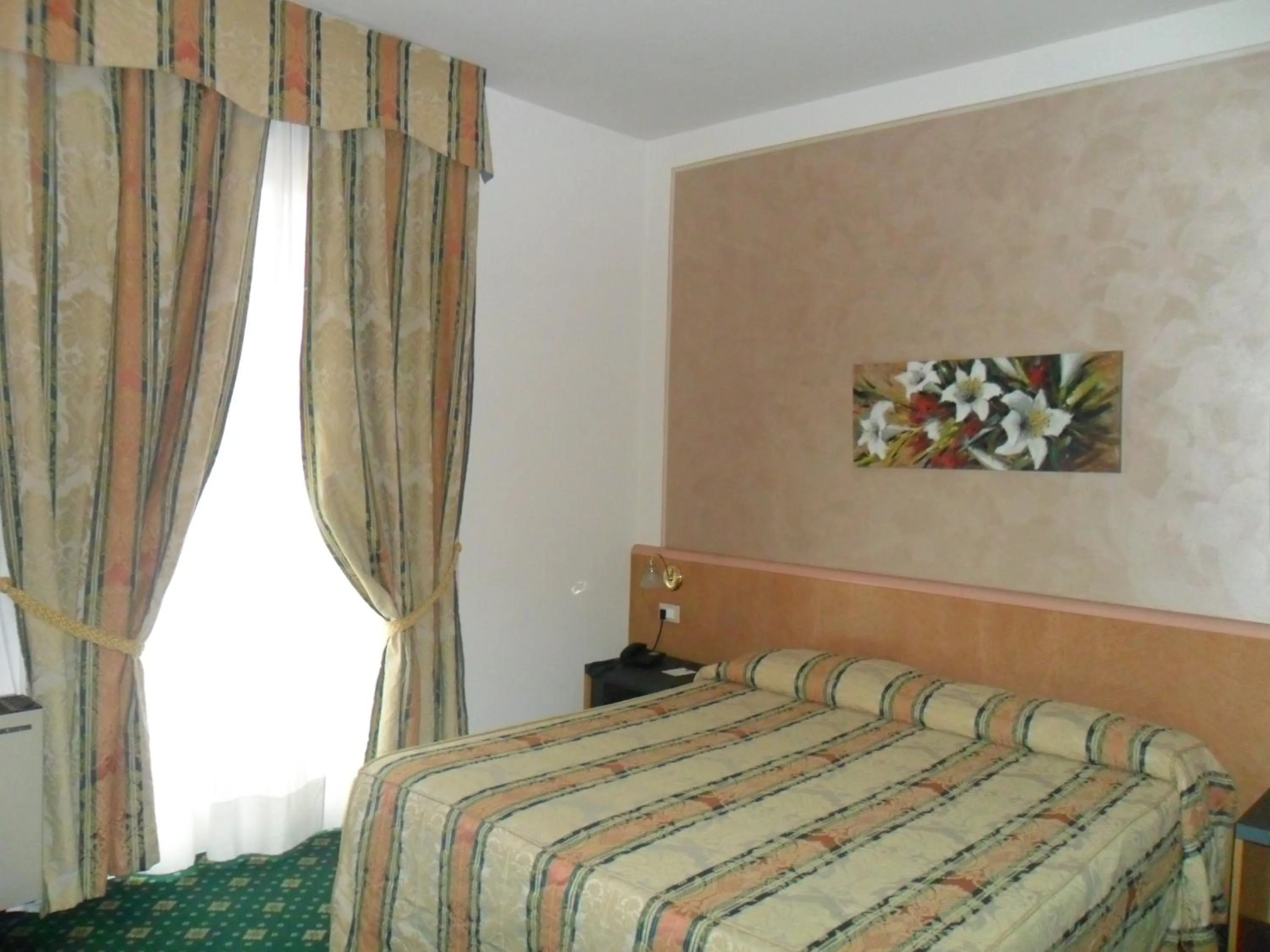 Bed in Hotel Riviera