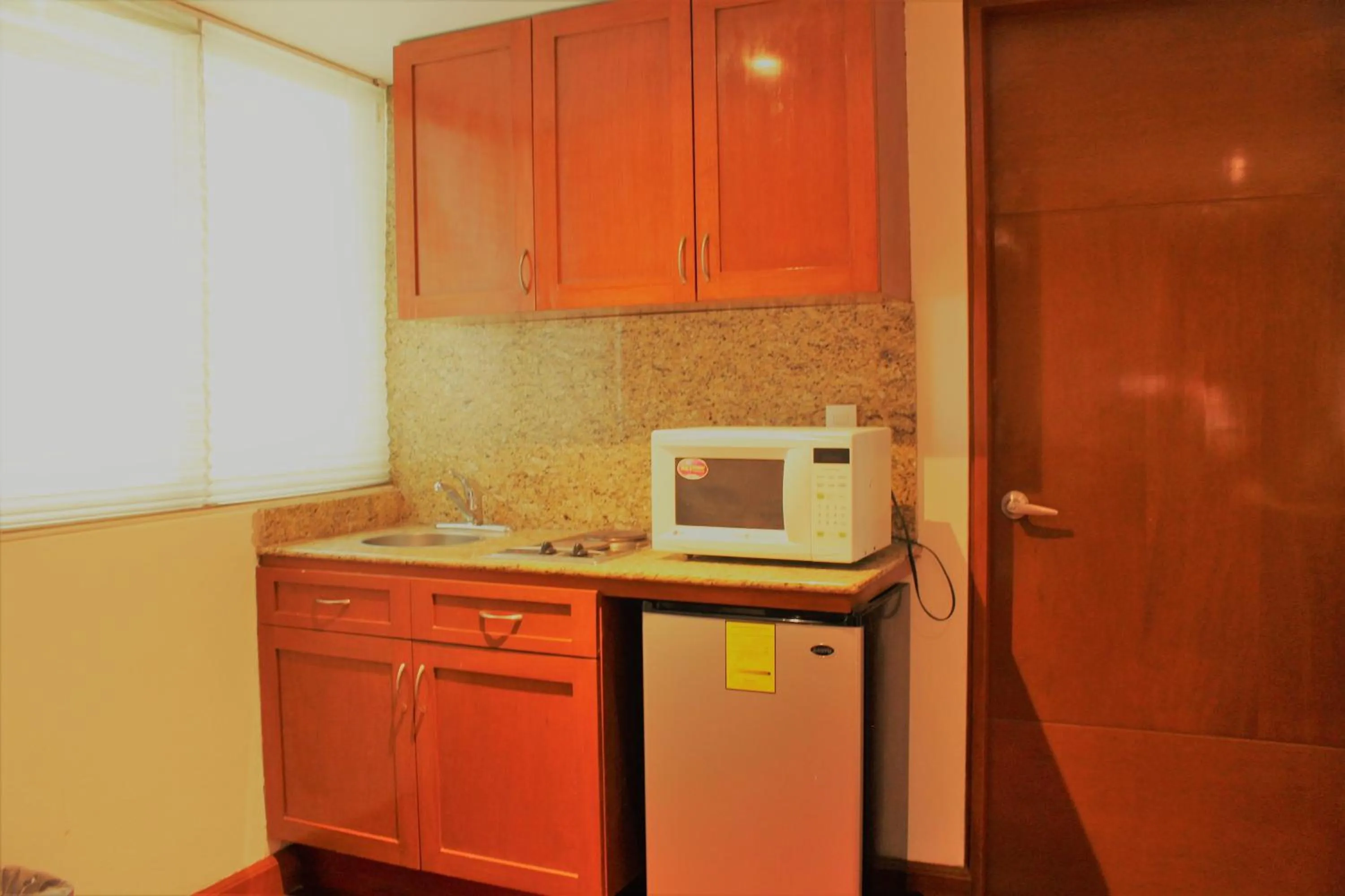 Kitchen or kitchenette in Condesa Suites