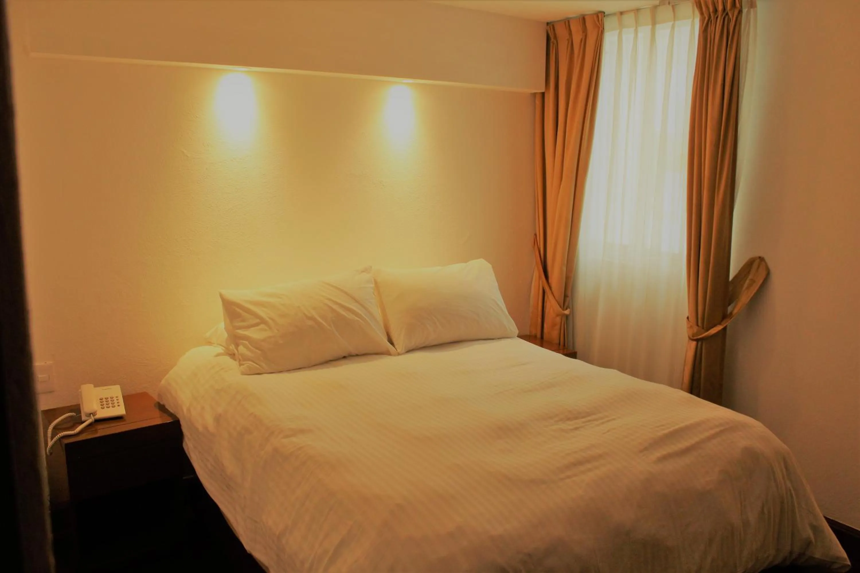 Bed in Condesa Suites