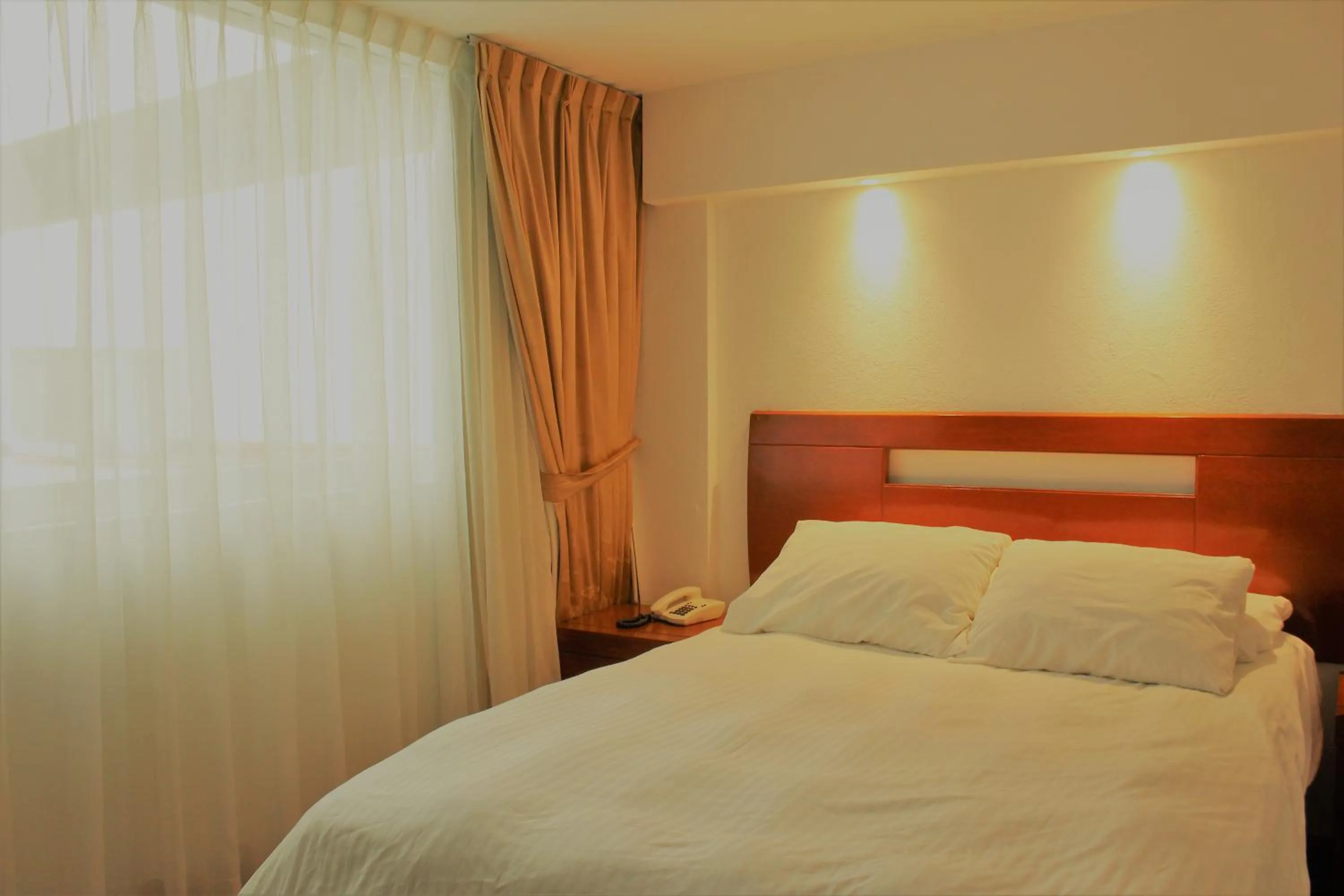 Bed in Condesa Suites